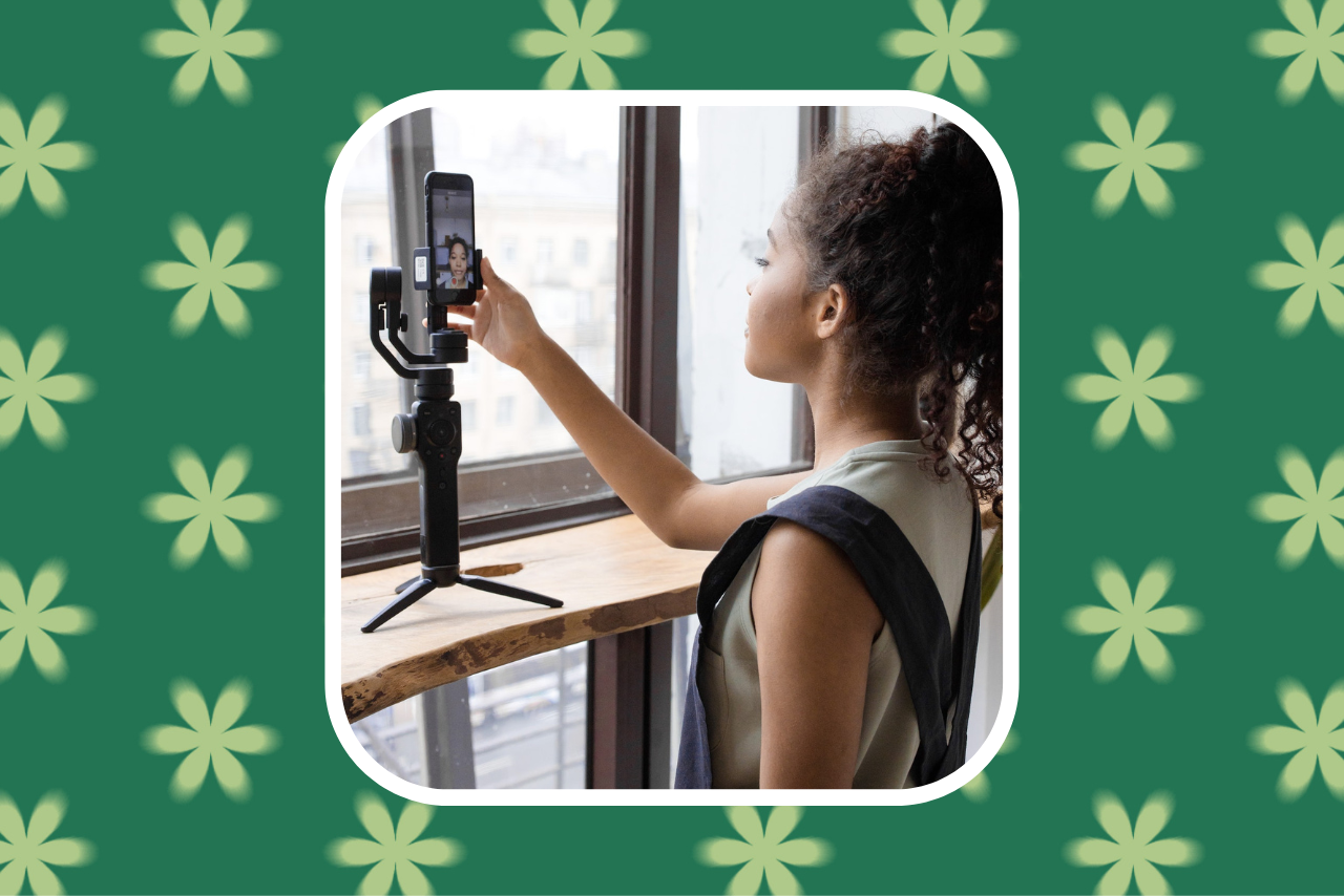 girl filming video on her phone with tripod