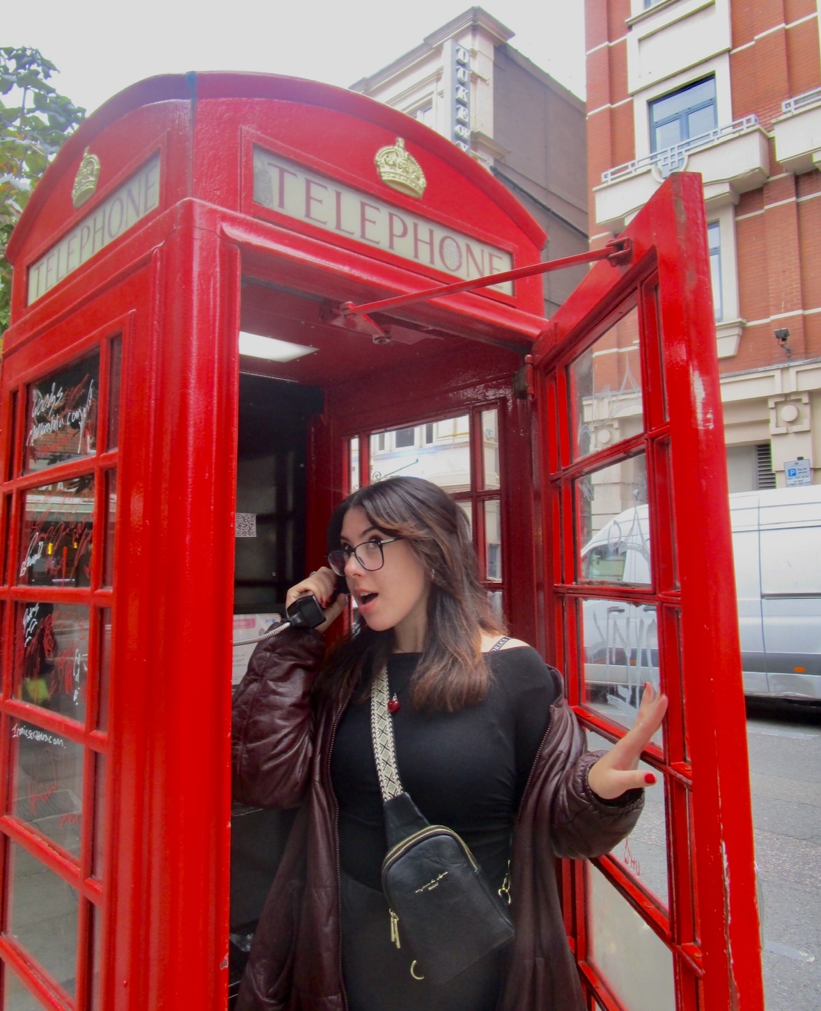 Woman in London phonebooth