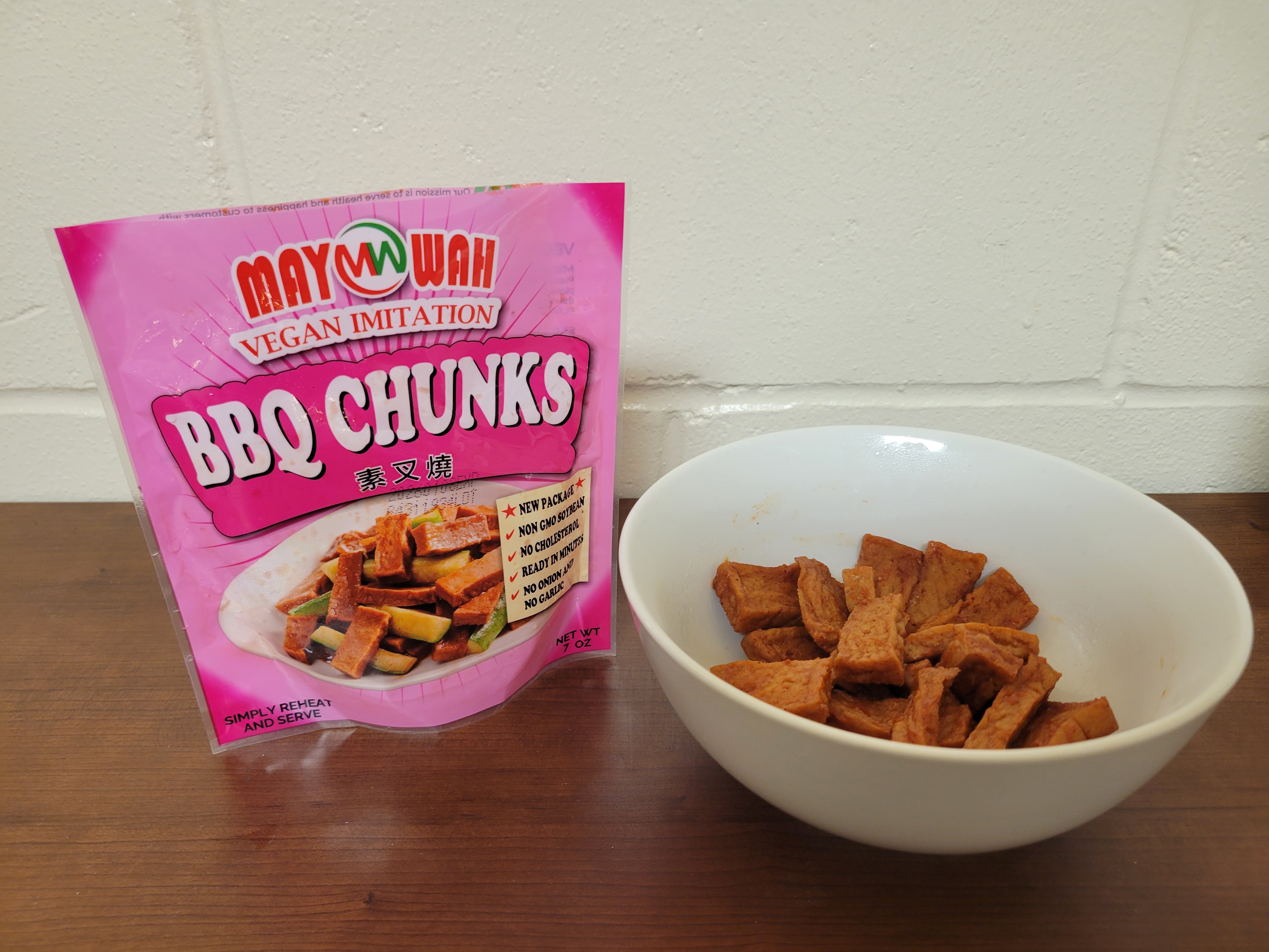 Vegan meat in a bowl with the bag next to it