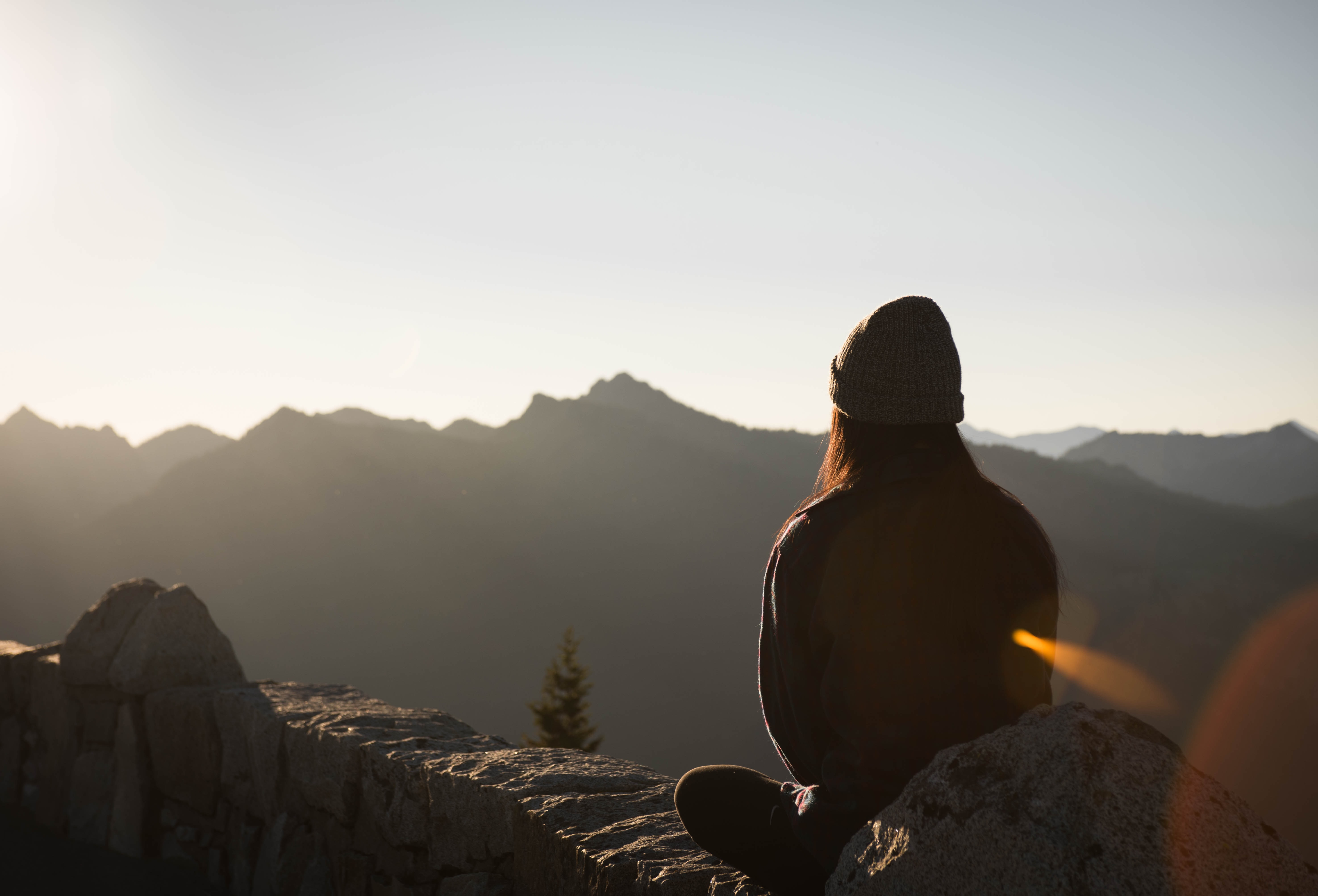 woman meditating on mountain