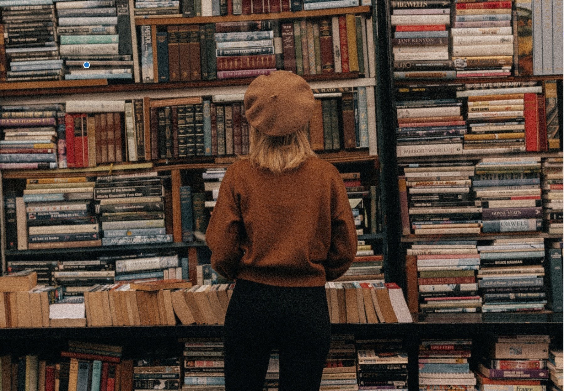Sarah in front of books by Johann Hygen