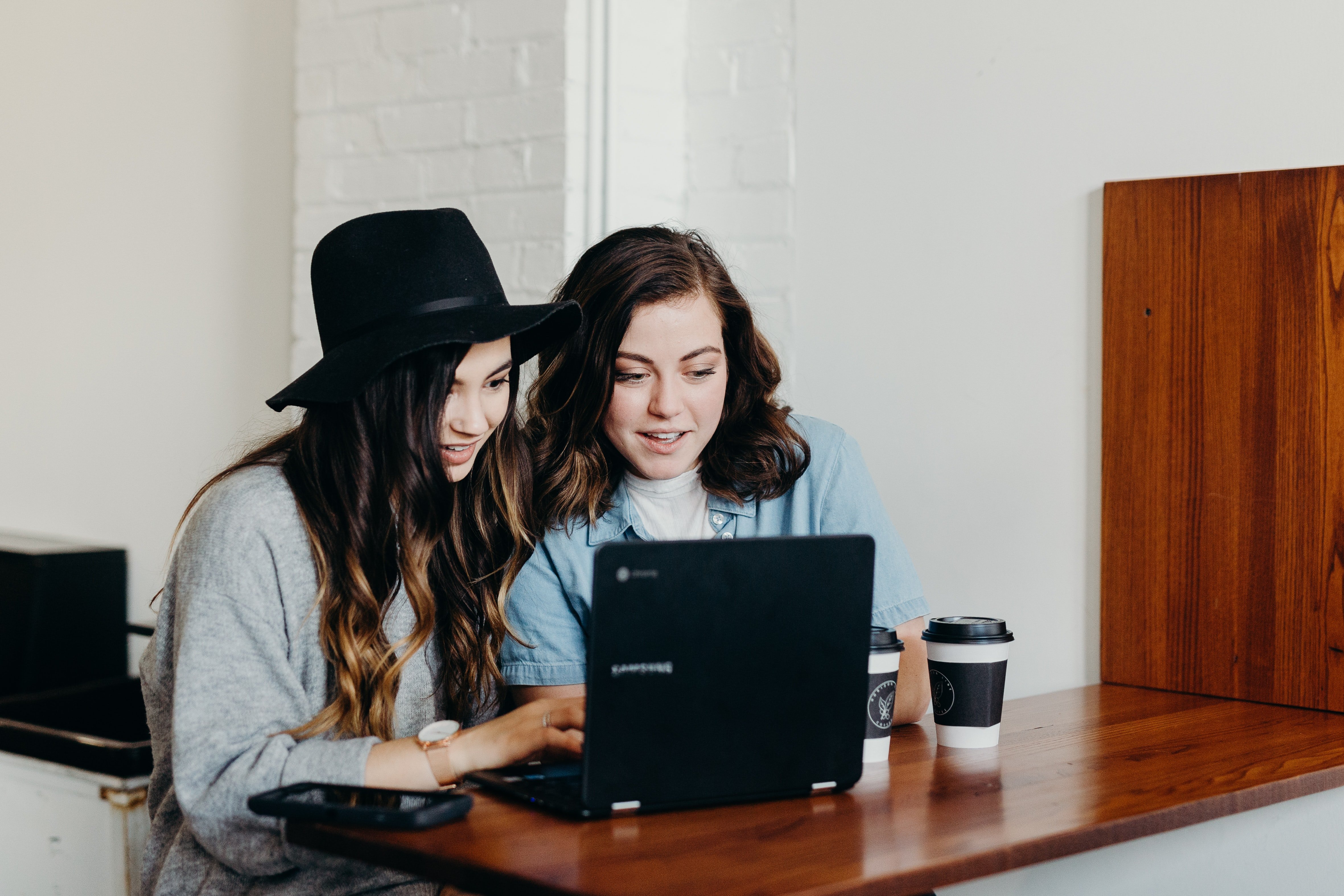 women sitting at computer by Brooke Cagle?width=698&height=466&fit=crop&auto=webp&dpr=4