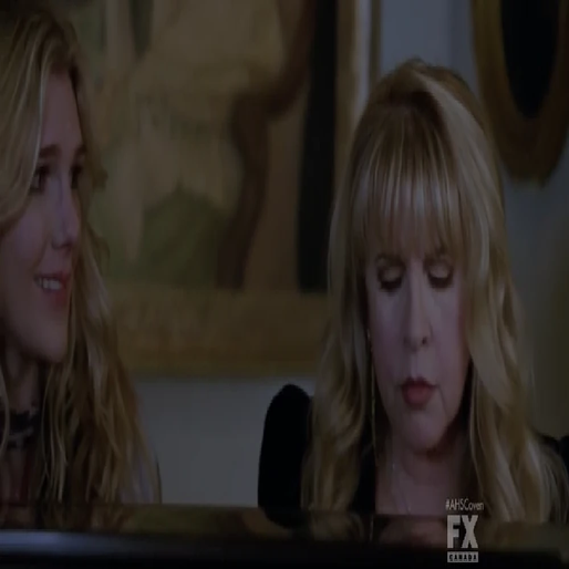 Stevie Nicks and Lily Rabe sitting at a piano on the set of \