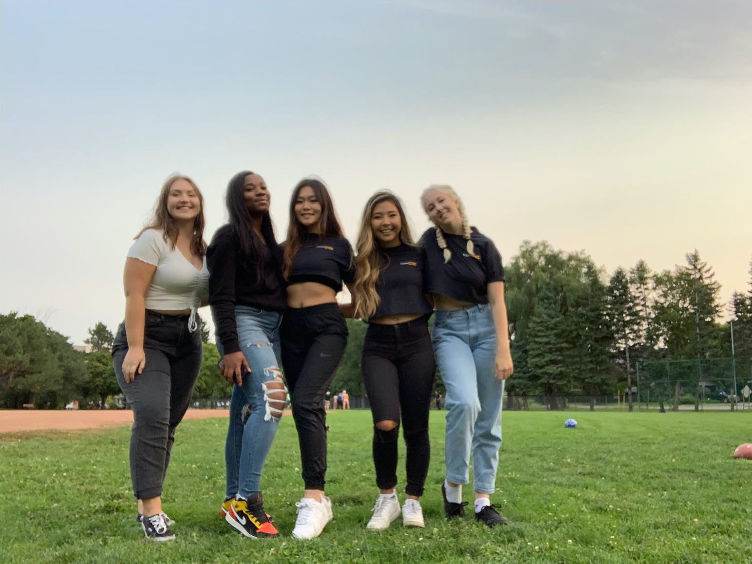 group of girl friends in a field