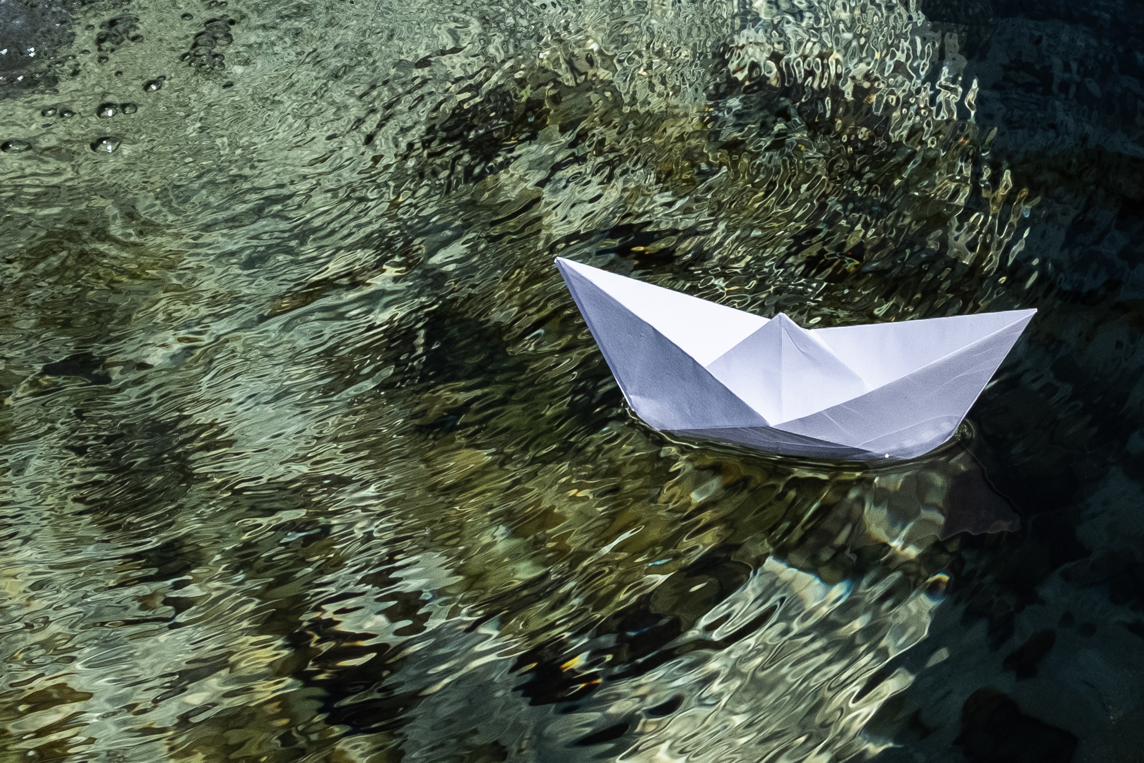 paper boat on water
