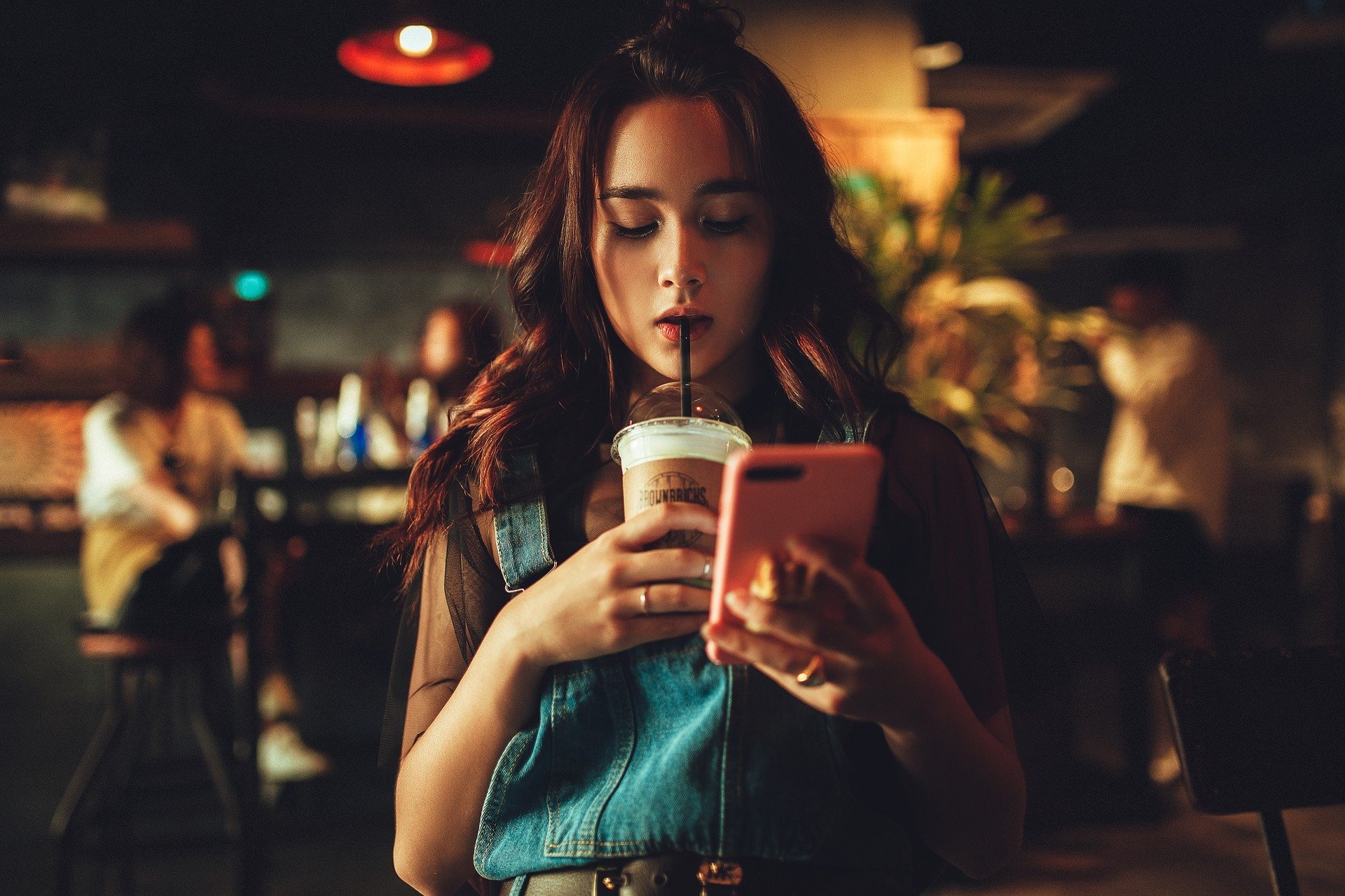 woman on phone in a coffee shop