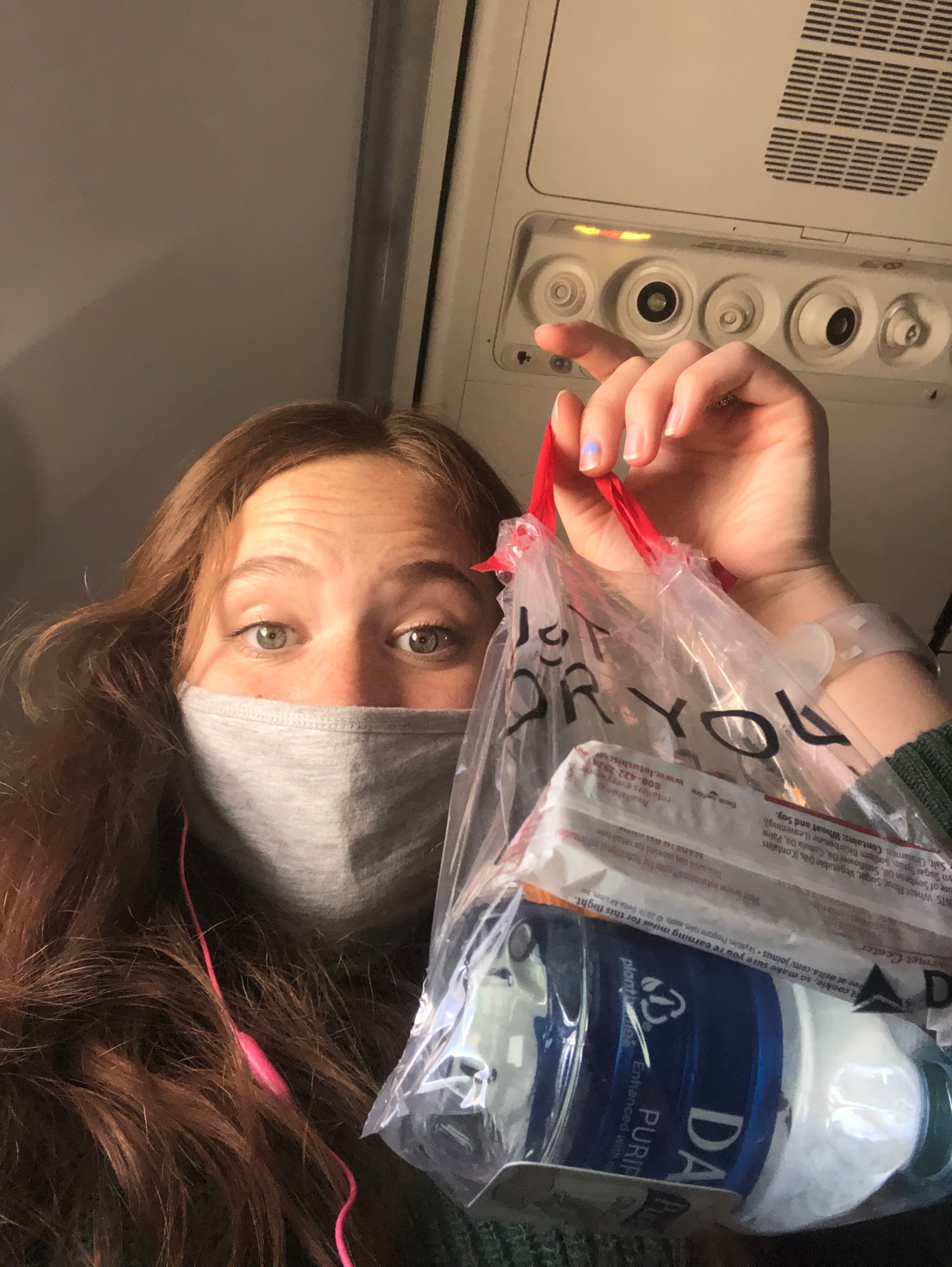 Izzy holding a bag of snacks