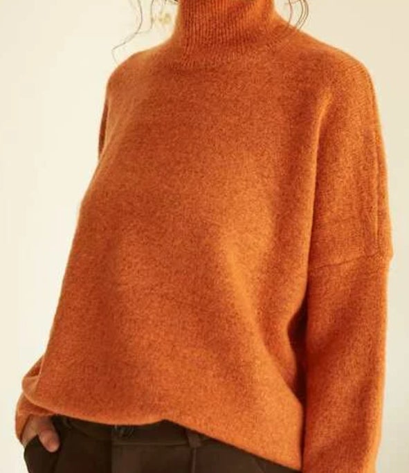 orange sweater with high neck