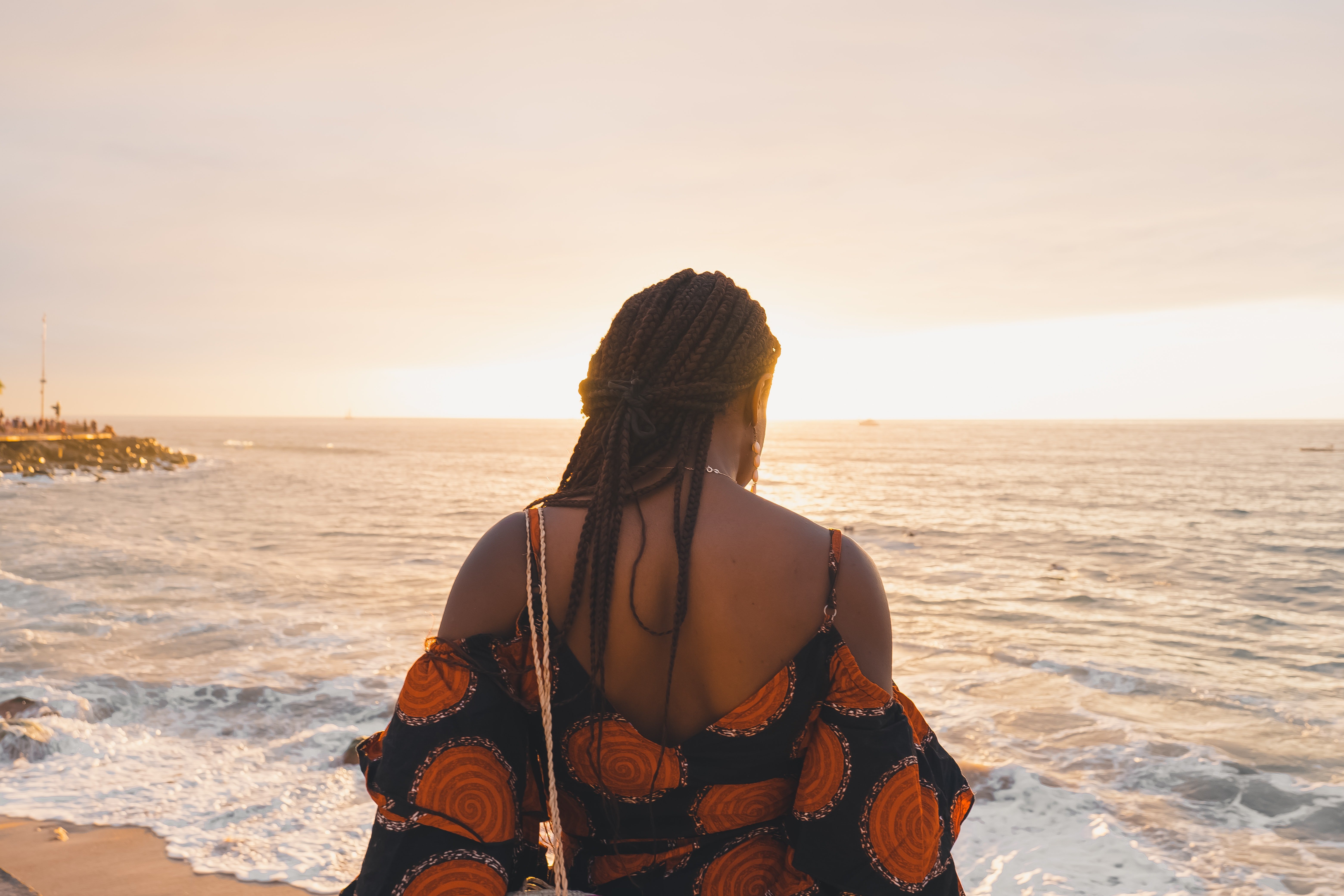 woman with braids on beach at sunset by Unsplash?width=698&height=466&fit=crop&auto=webp&dpr=4