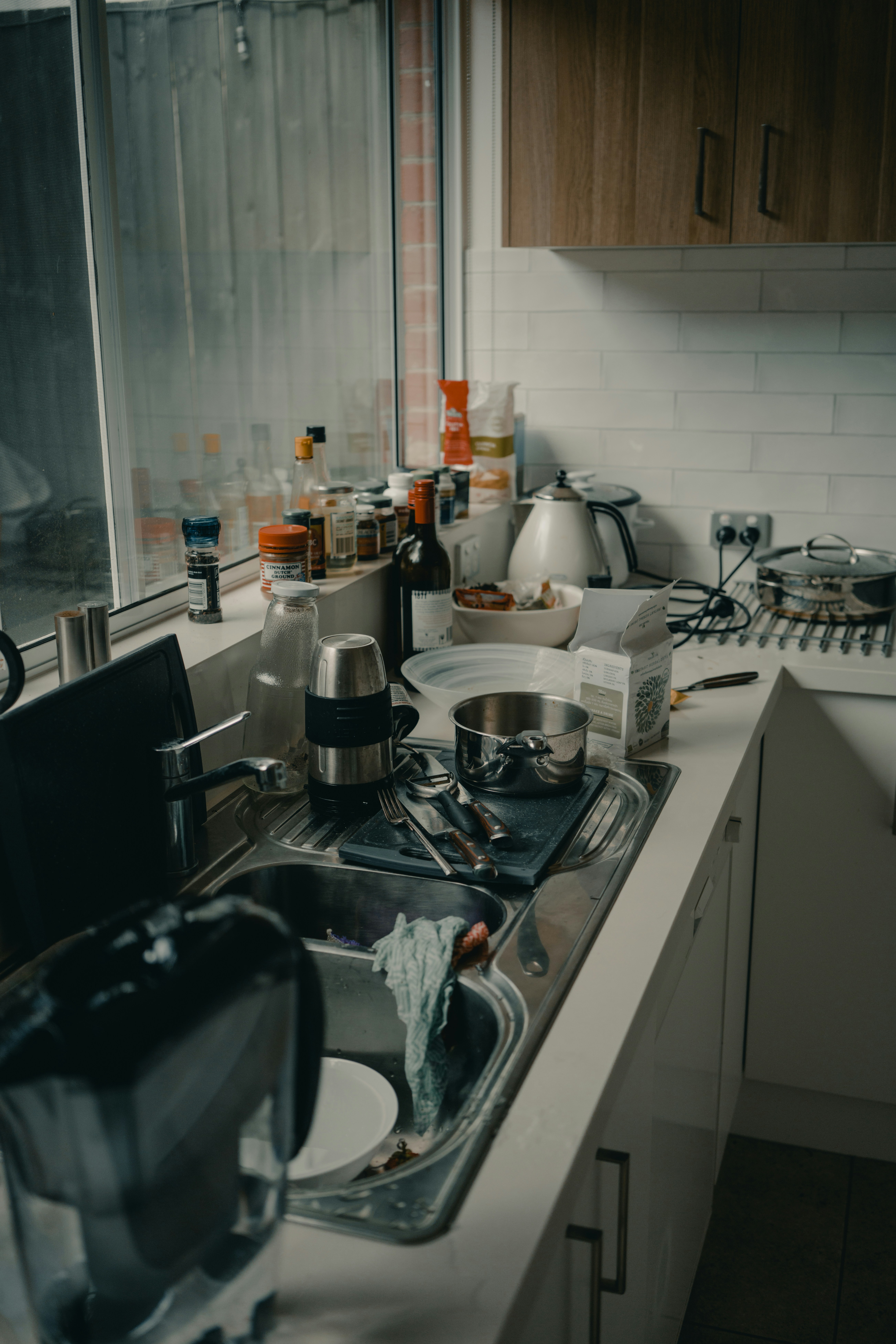 Messy kitchen. Photo by Arun Clarke from Unsplash