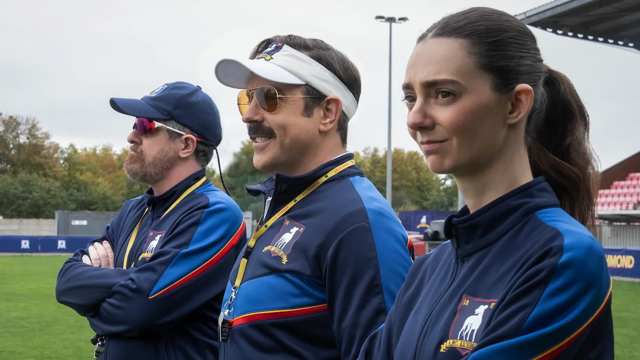 Still of Coach Beard, Ted Lasso, and Coach Alice from \"Ted Lasso\" season 4.