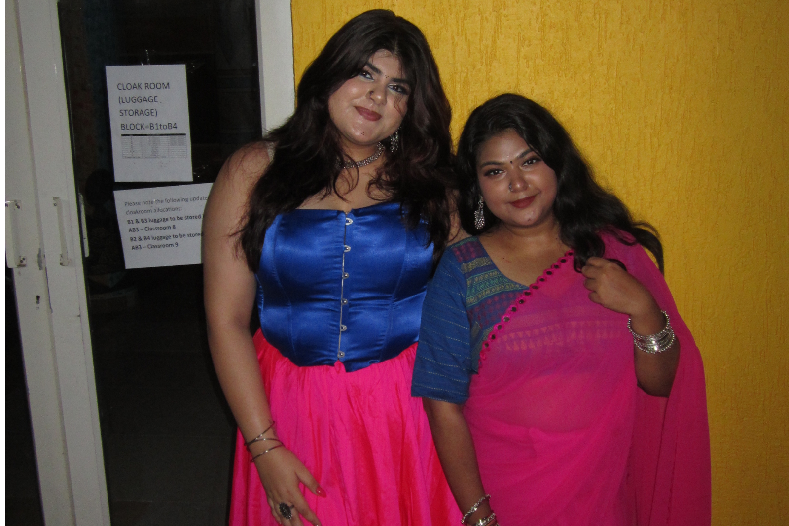 Best friends in matching traditional wear.