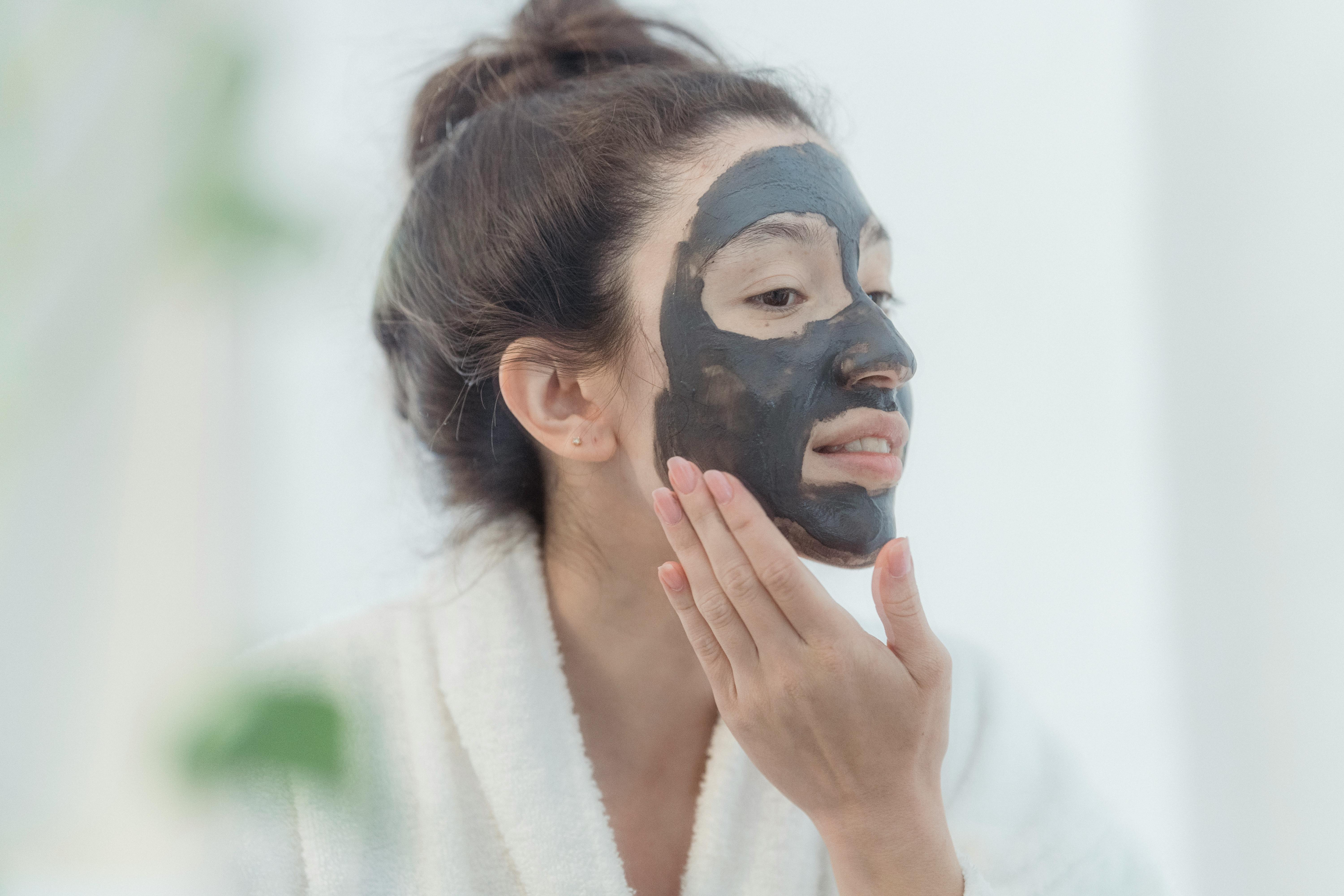 woman applying face mask