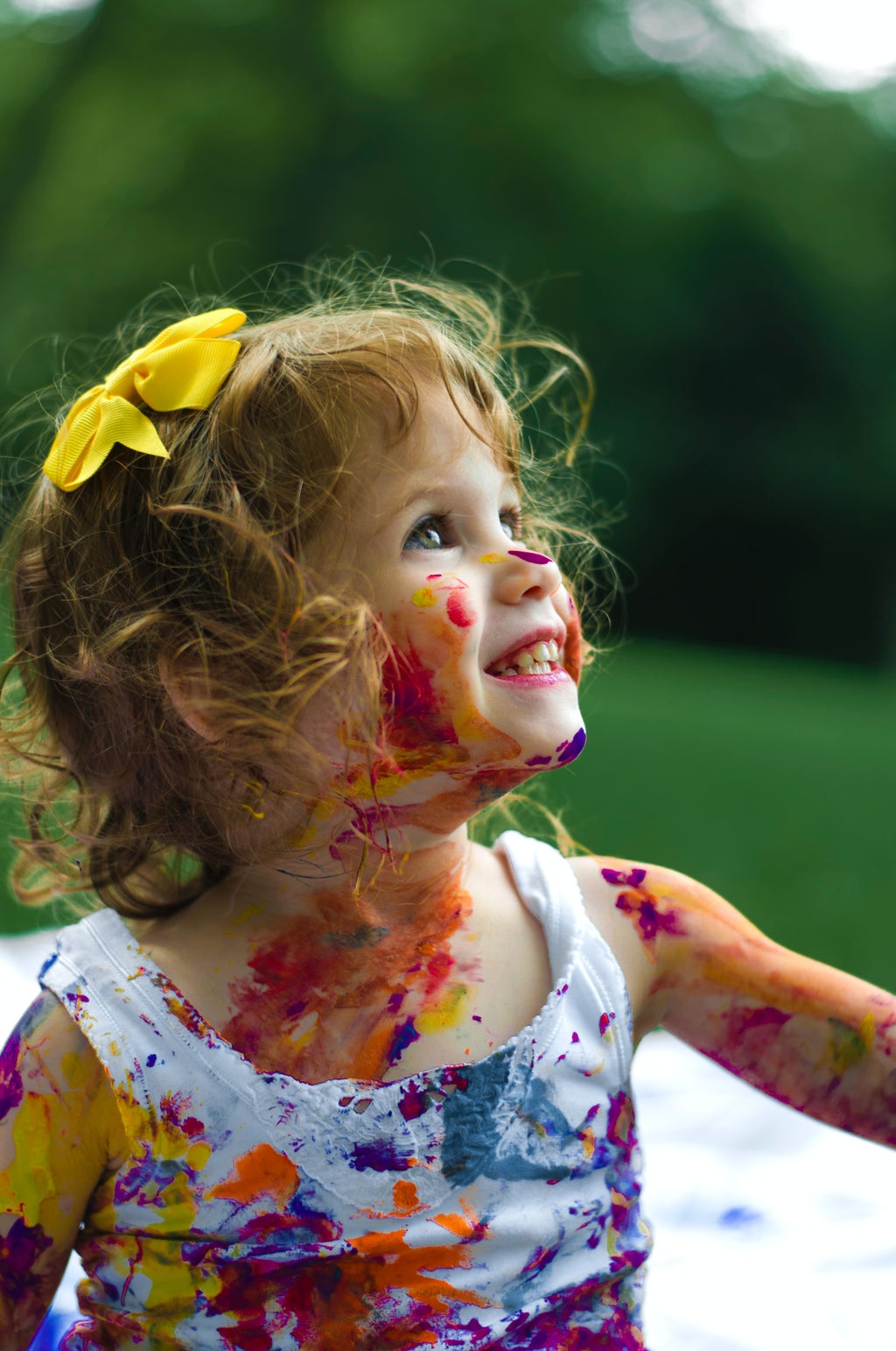 young girl covered in paint
