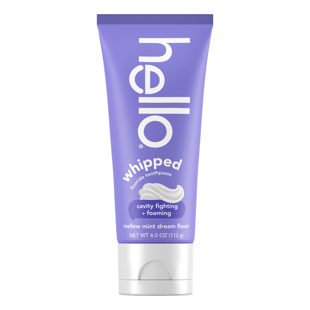 A purple tube of Hello whipped fluoride toothpaste, mellow mint dream flavor, 4 oz, labeled as cavity fighting and foaming.