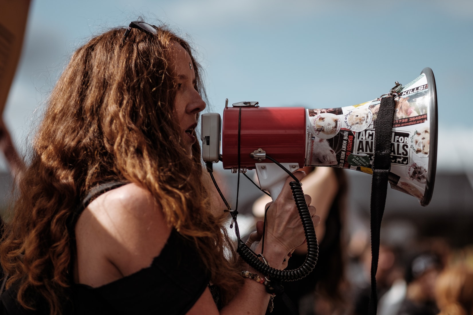 protester on megaphone by Clem Onojeghuo?width=698&height=466&fit=crop&auto=webp&dpr=4