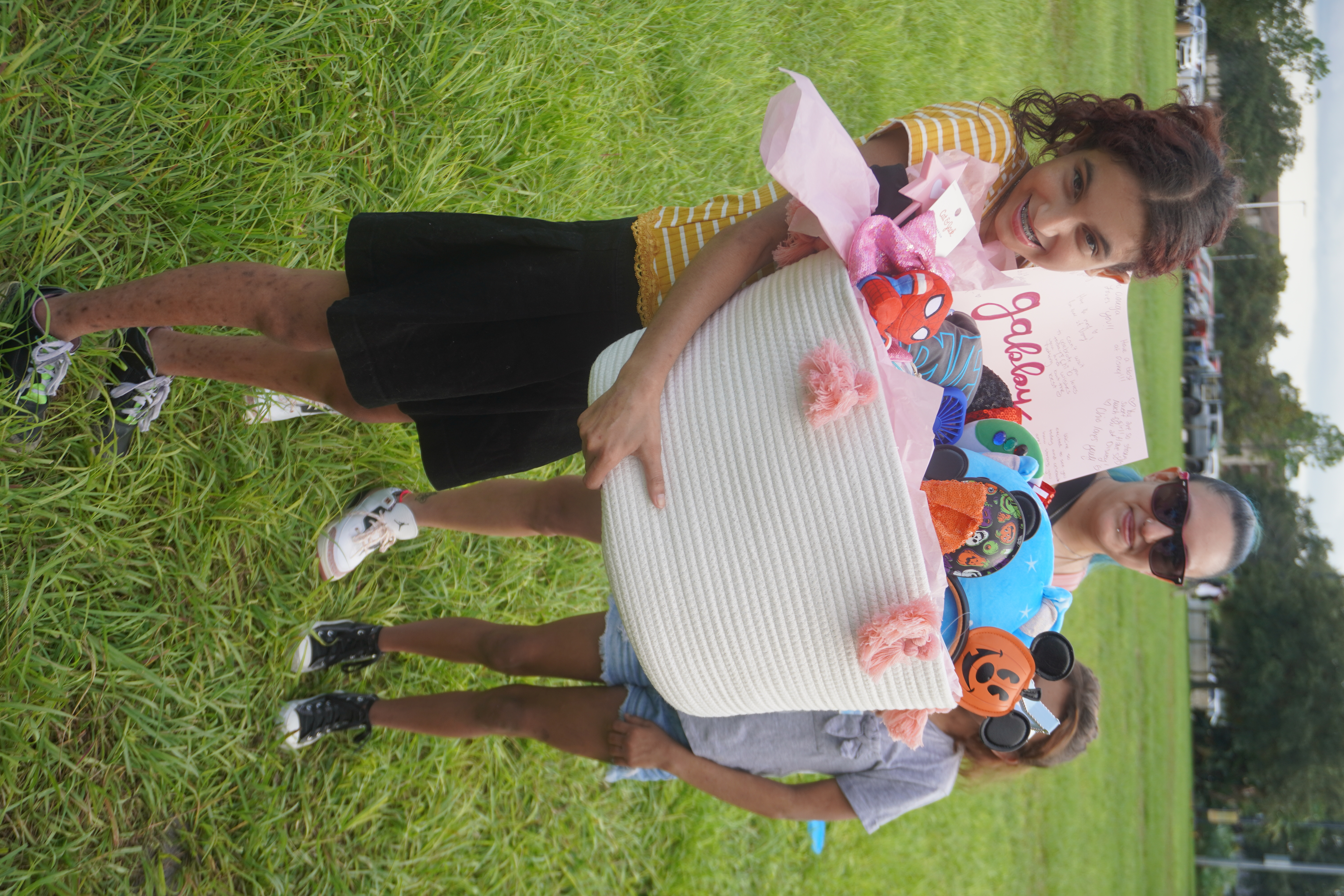 gabby accepting her gift from make a wish