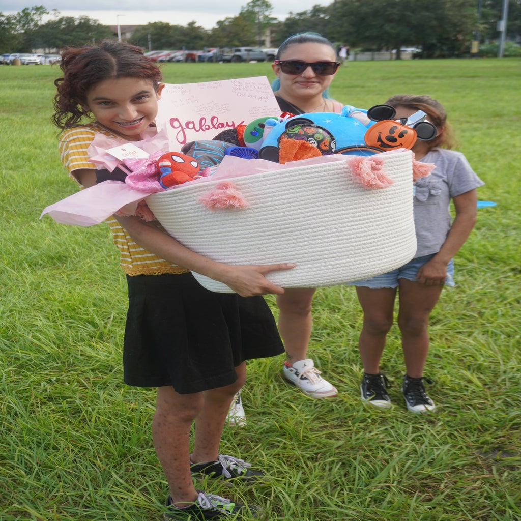 gabby accepting her gift from make a wish