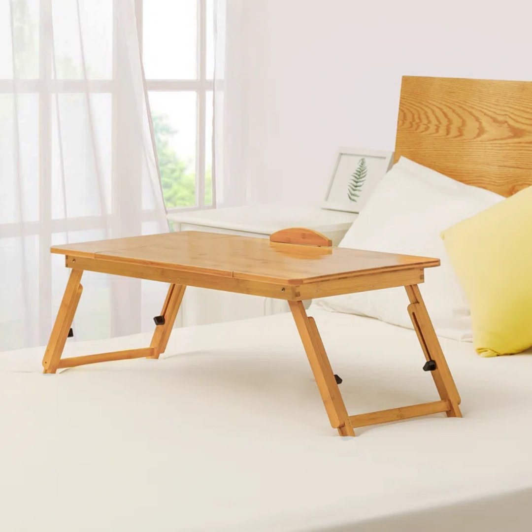 light wood folding lap tray on bed