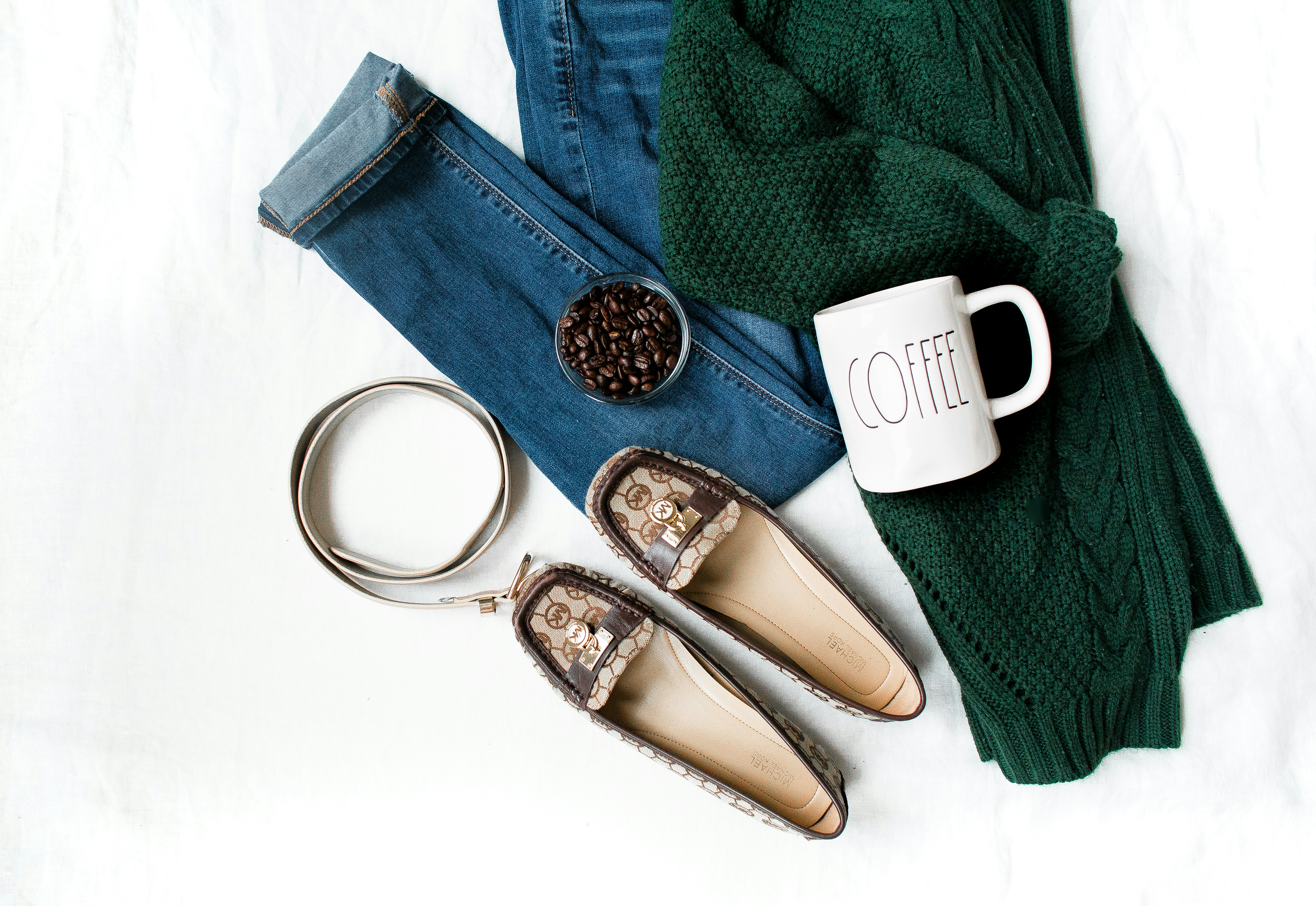Outfit laid out with coffee.