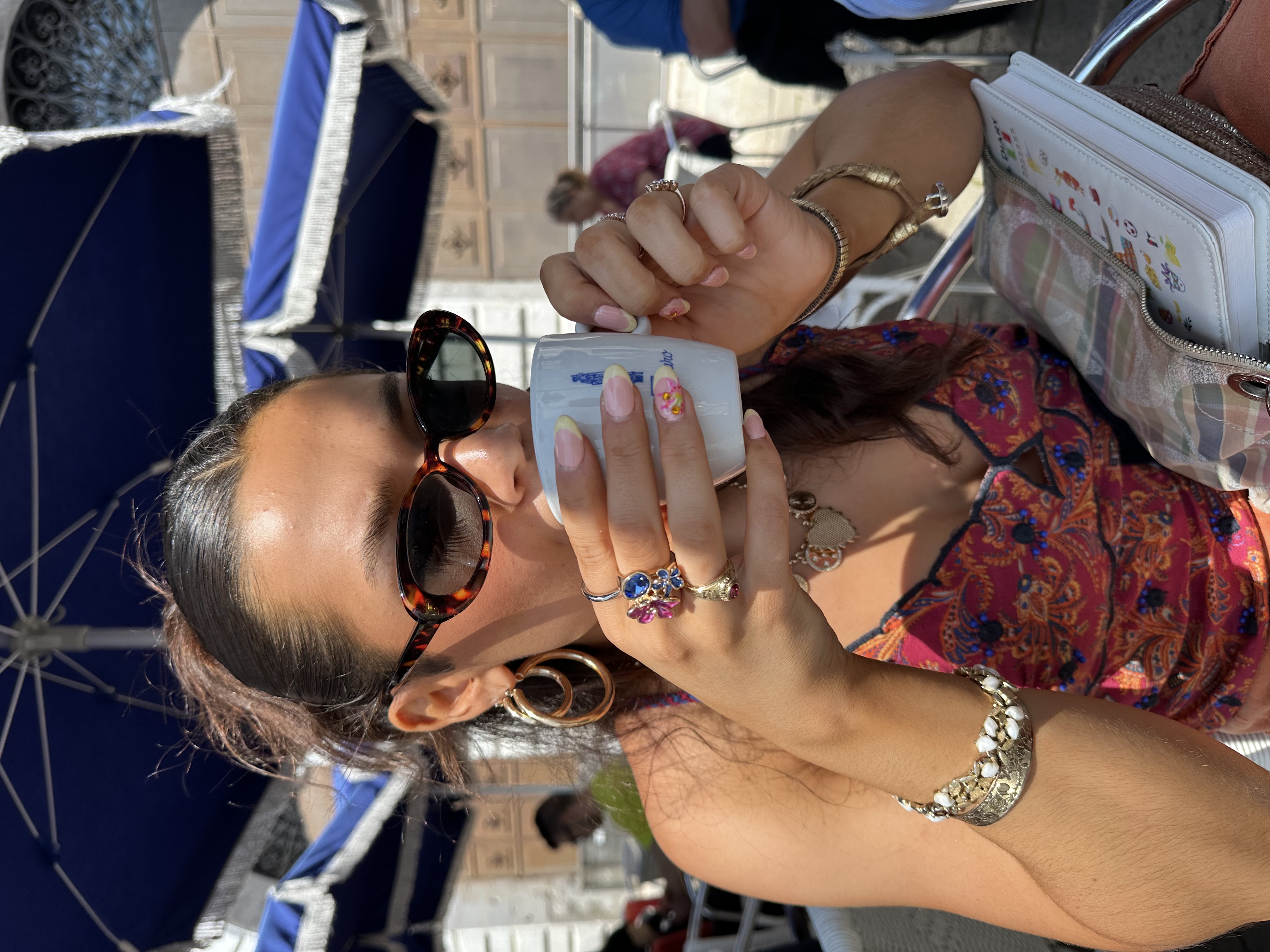 Girl drinking coffee with rings