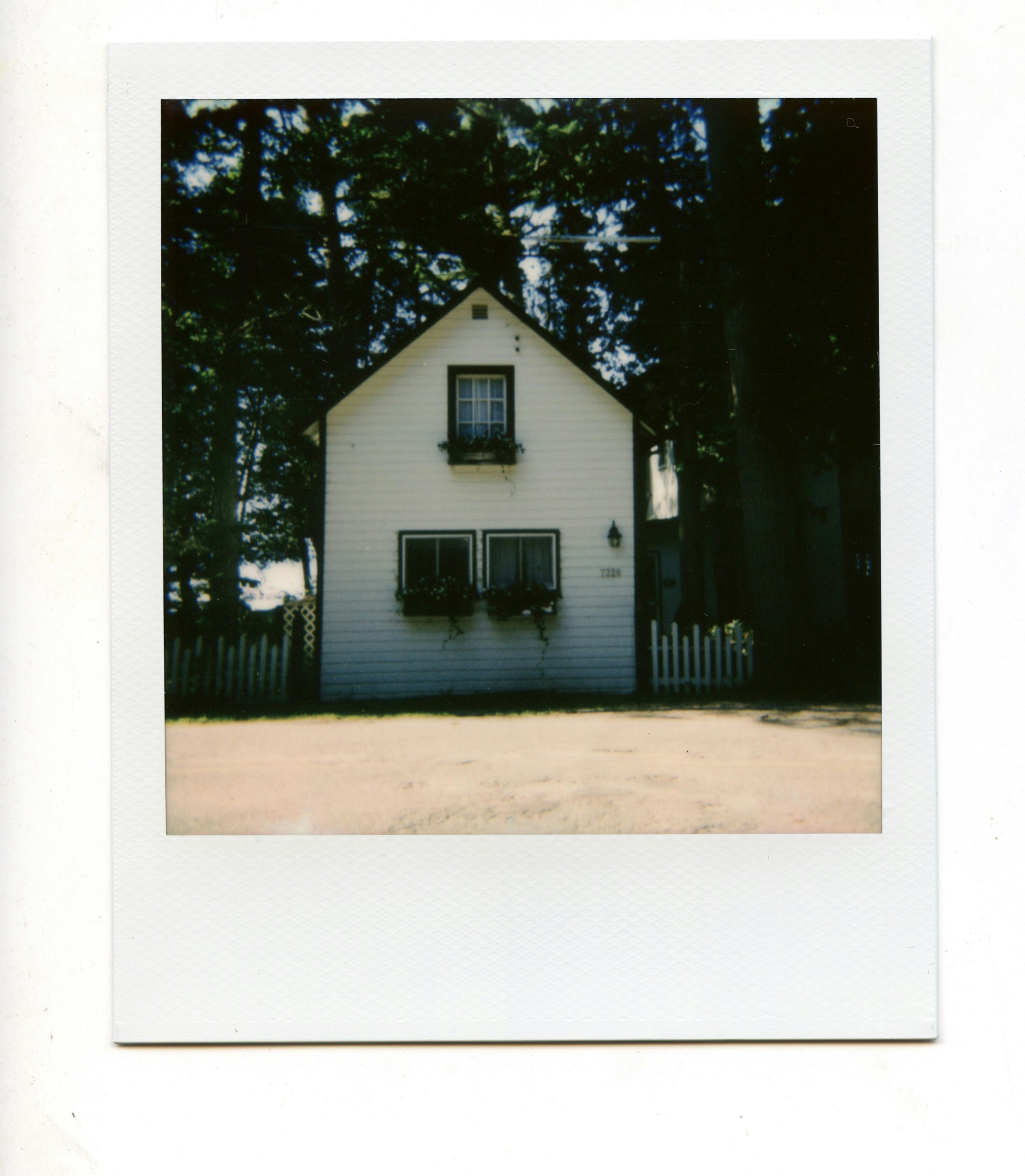 Polaroid picture of a white house