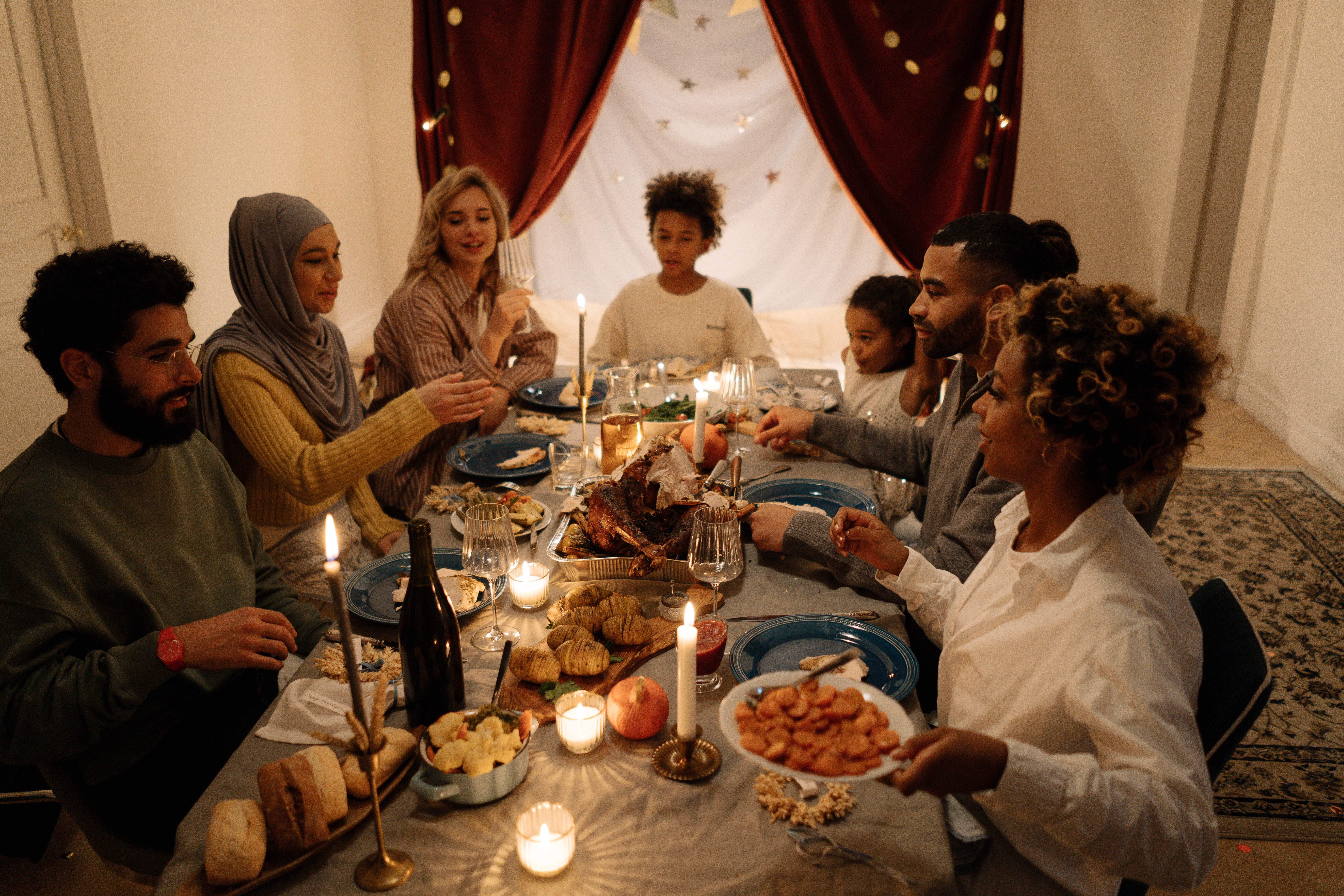 A group of people around a dinner table.