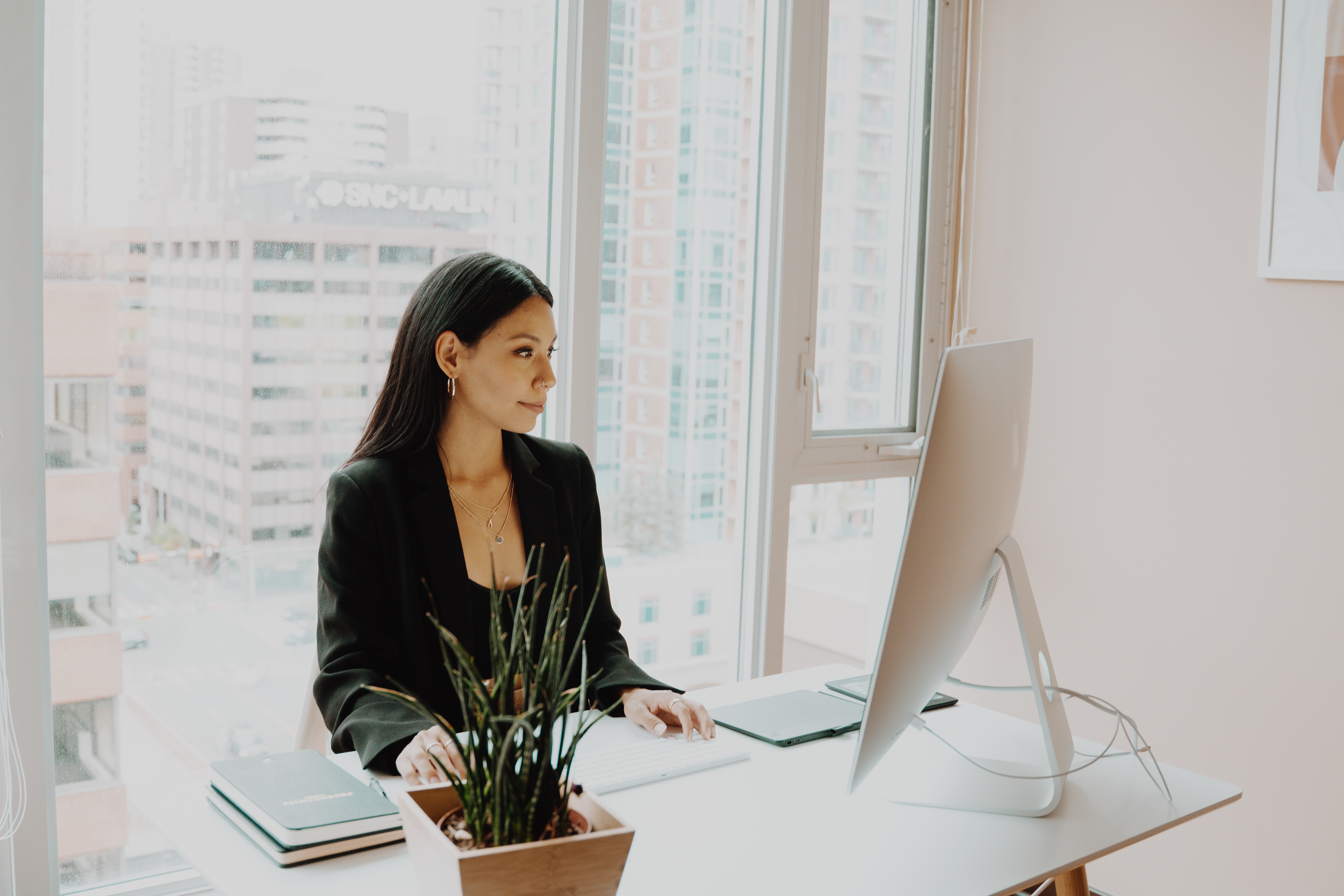 A woman sitting at an office desk