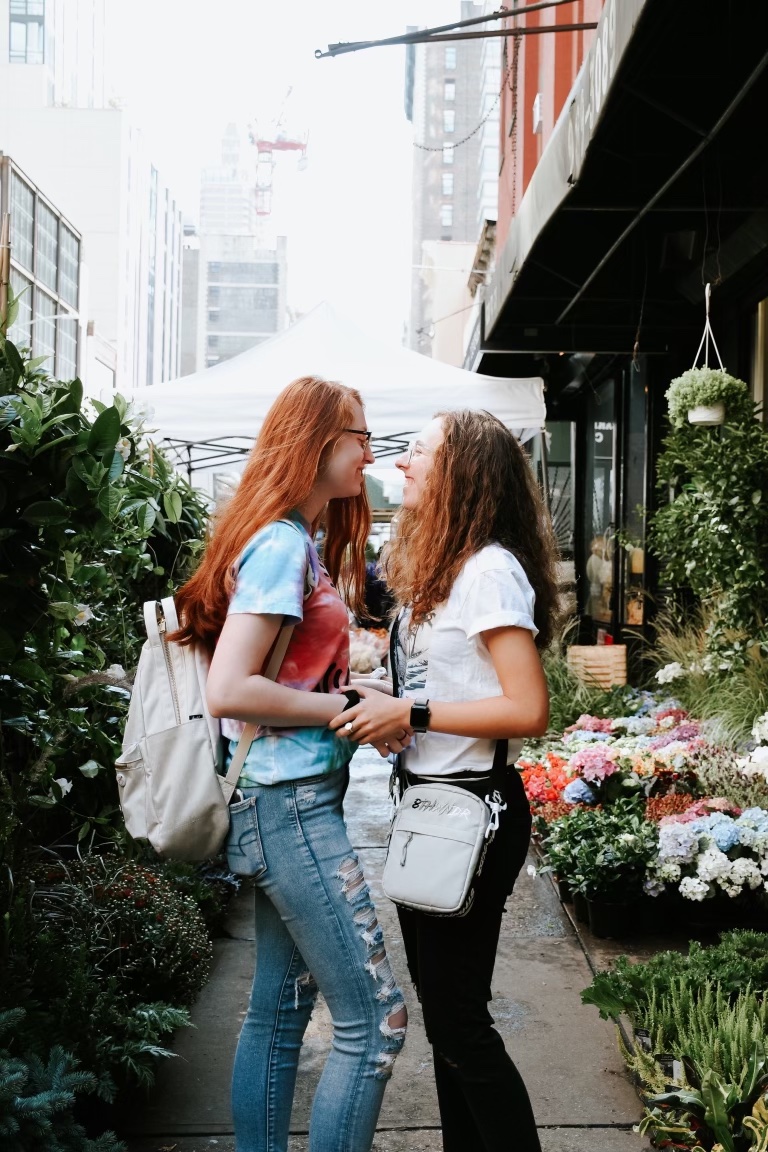 Girlfriend and girlfriend posing at market