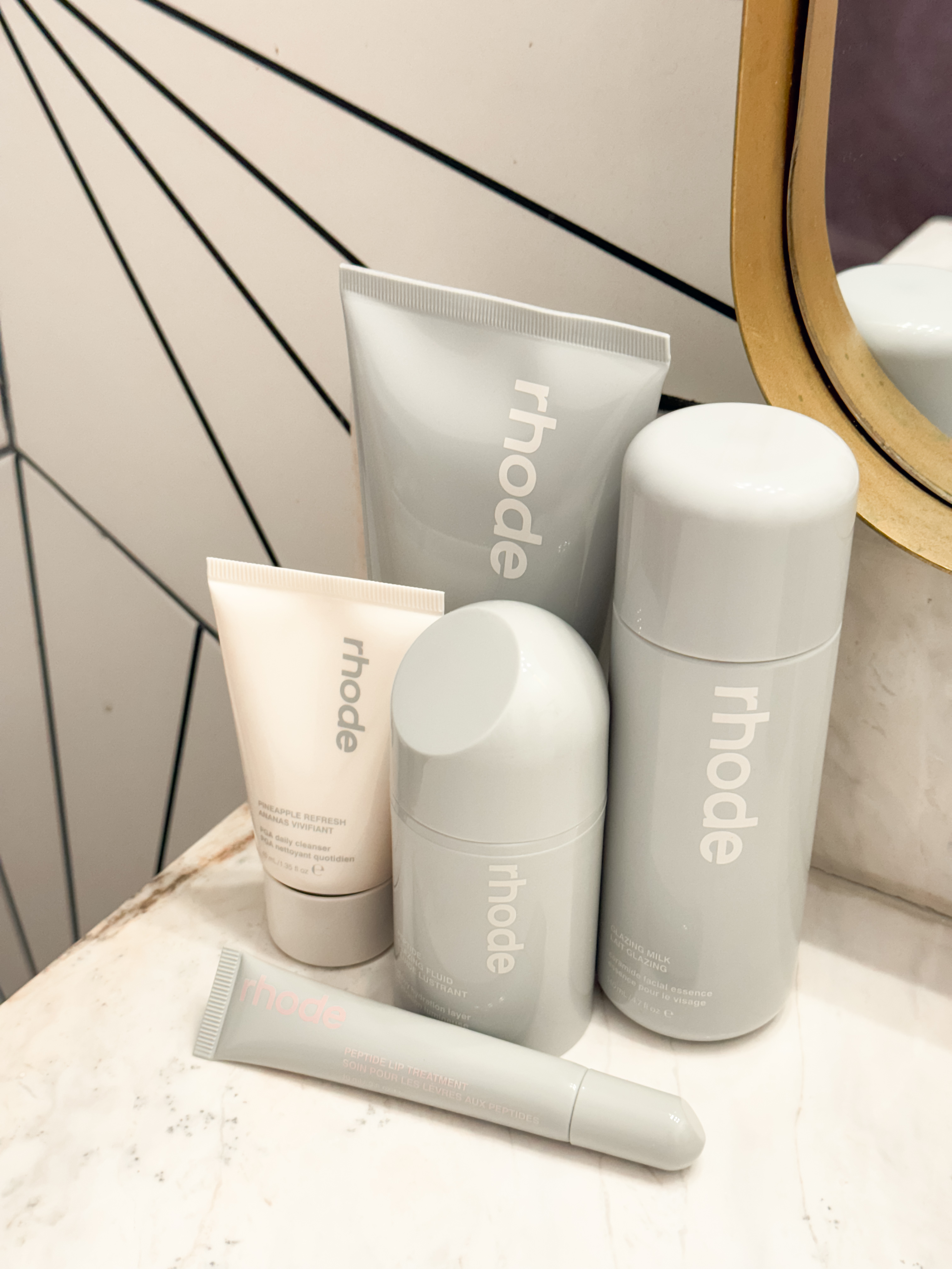 My personal photo of my Rhode skincare collection