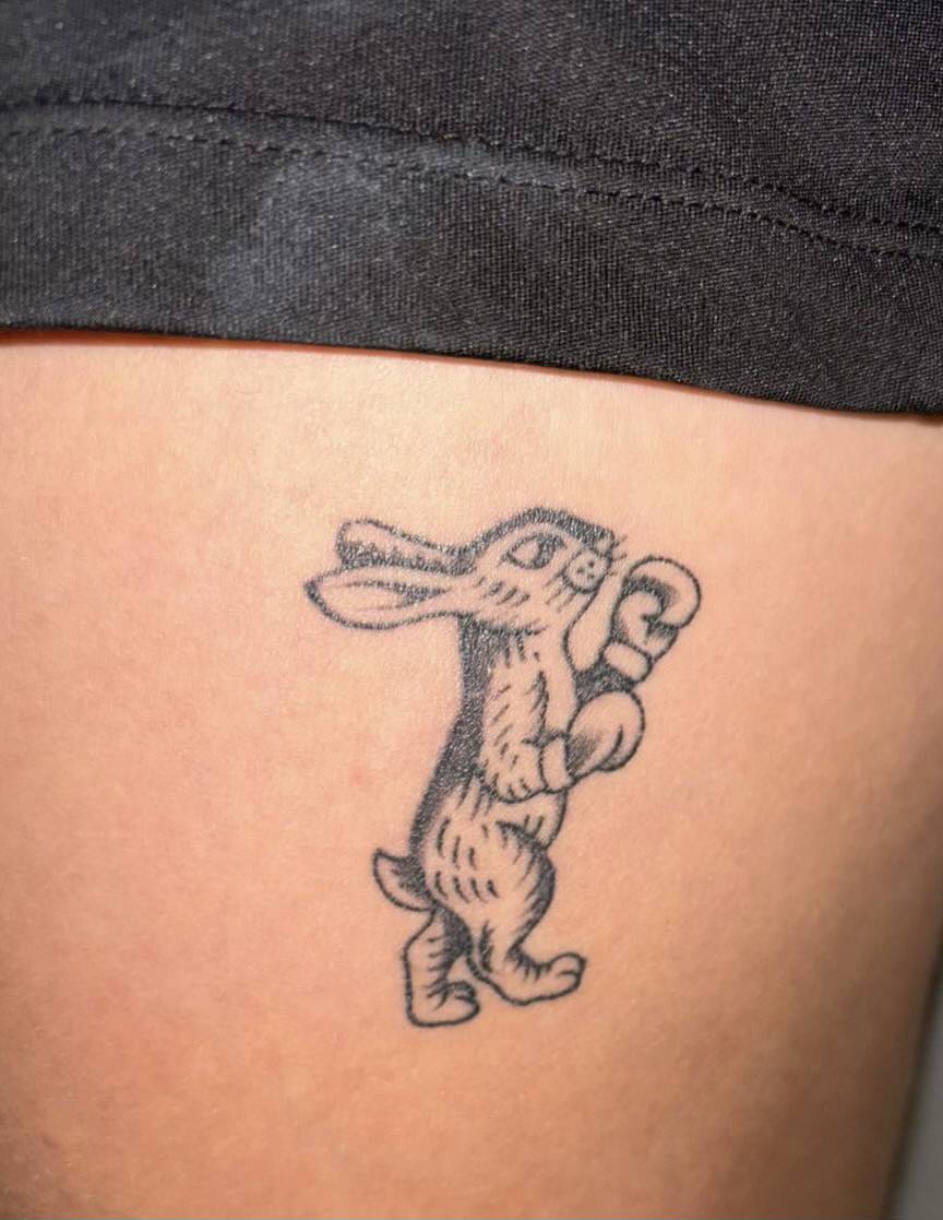 a tattoo of a rabbit boxing