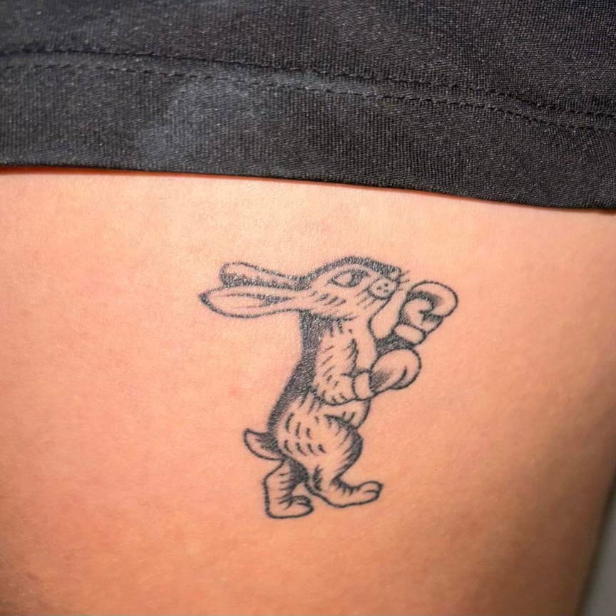 a tattoo of a rabbit boxing