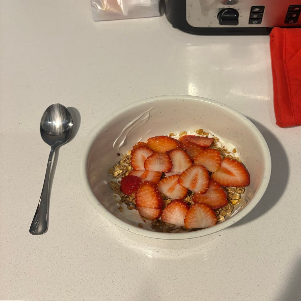 strawberries in a bowl with granola and yogurt