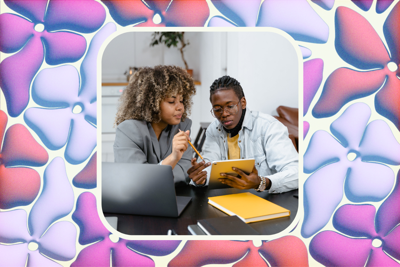 Two people looking at iPad.