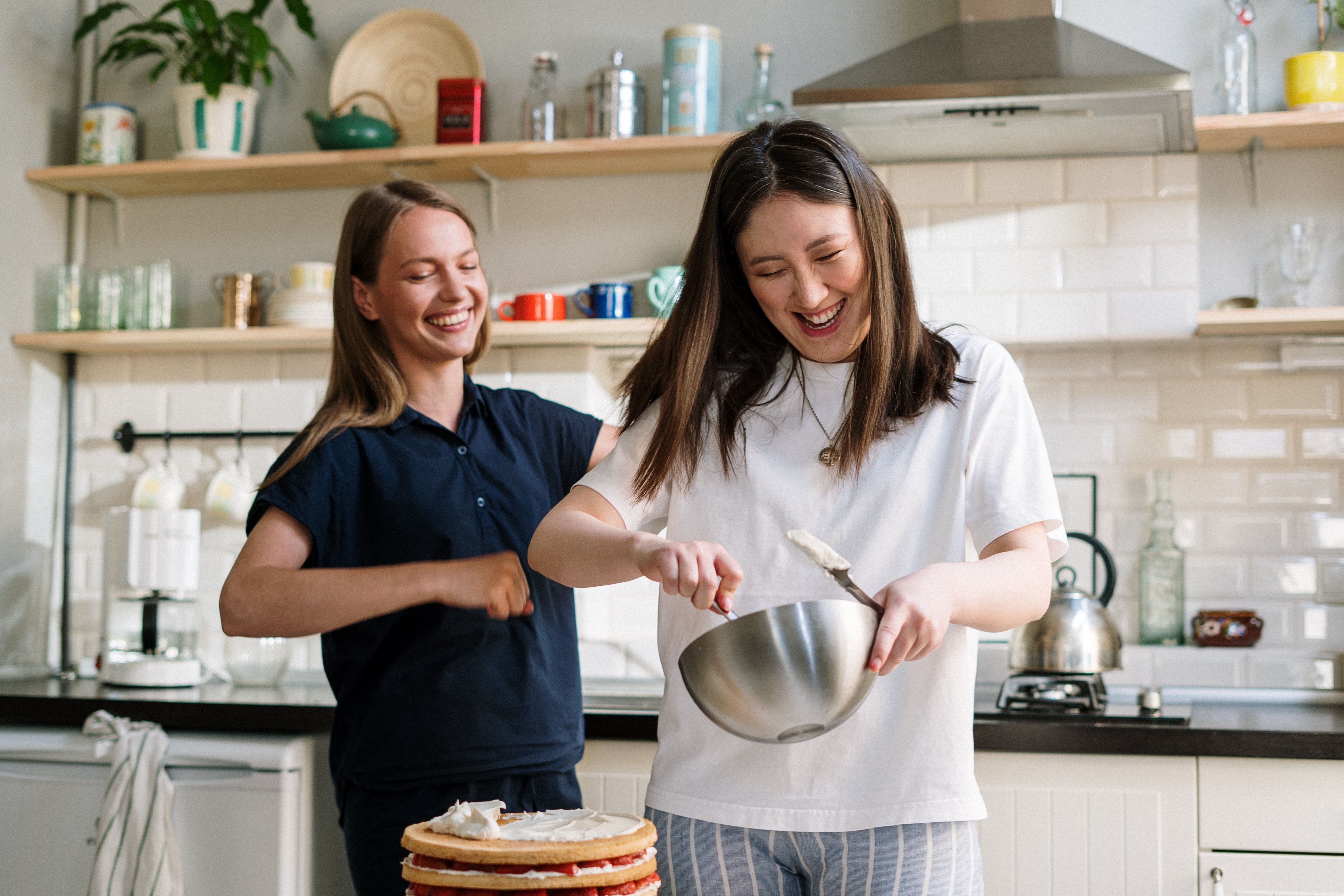 Women laughing and baking.