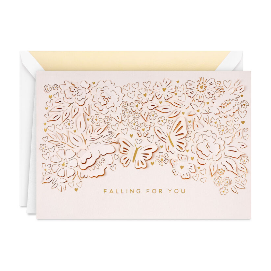 Delicate floral and butterfly laser-cut card with the words \