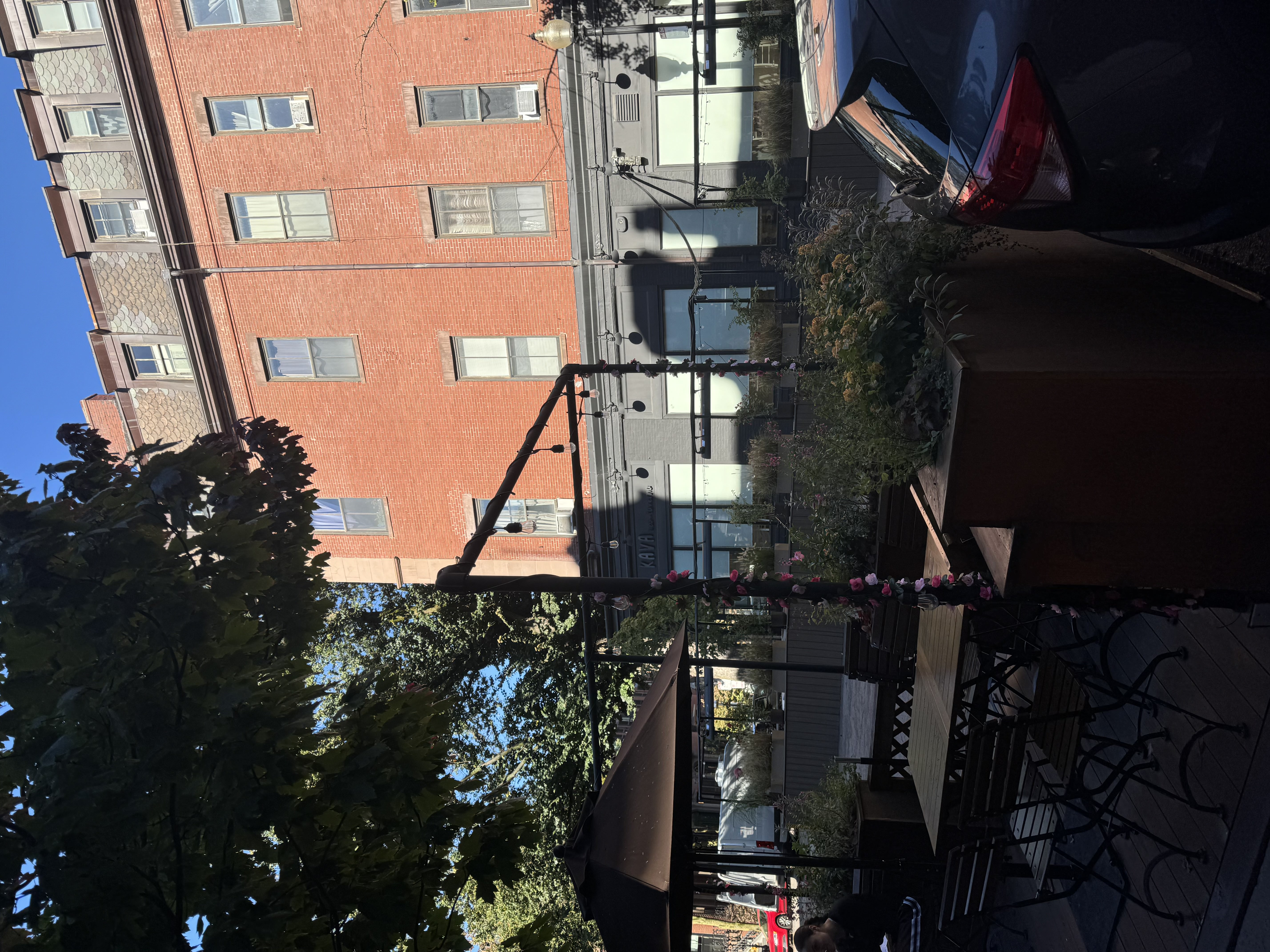 view patio seating with a building in the back