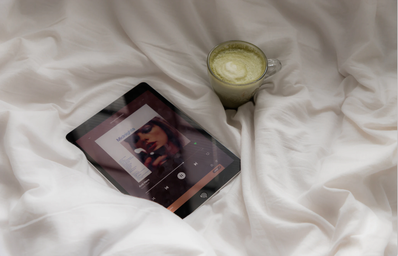 TAYLOR SWIFT Midnights album on iPad next to matcha latte