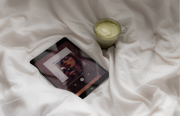TAYLOR SWIFT Midnights album on iPad next to matcha latte