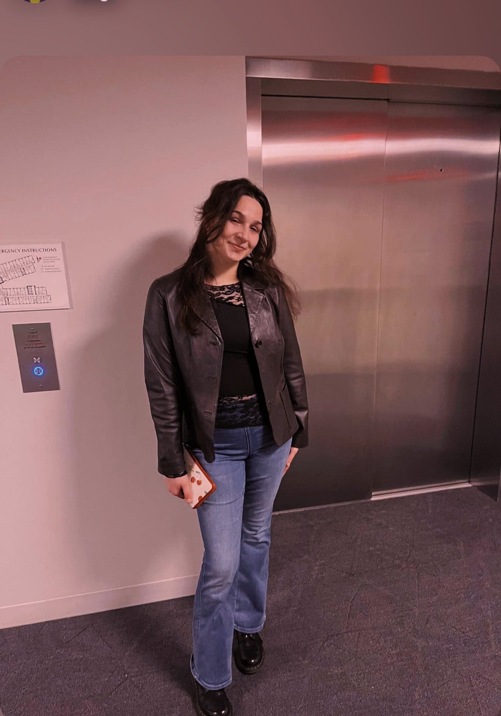 Woman standing in front of elevator