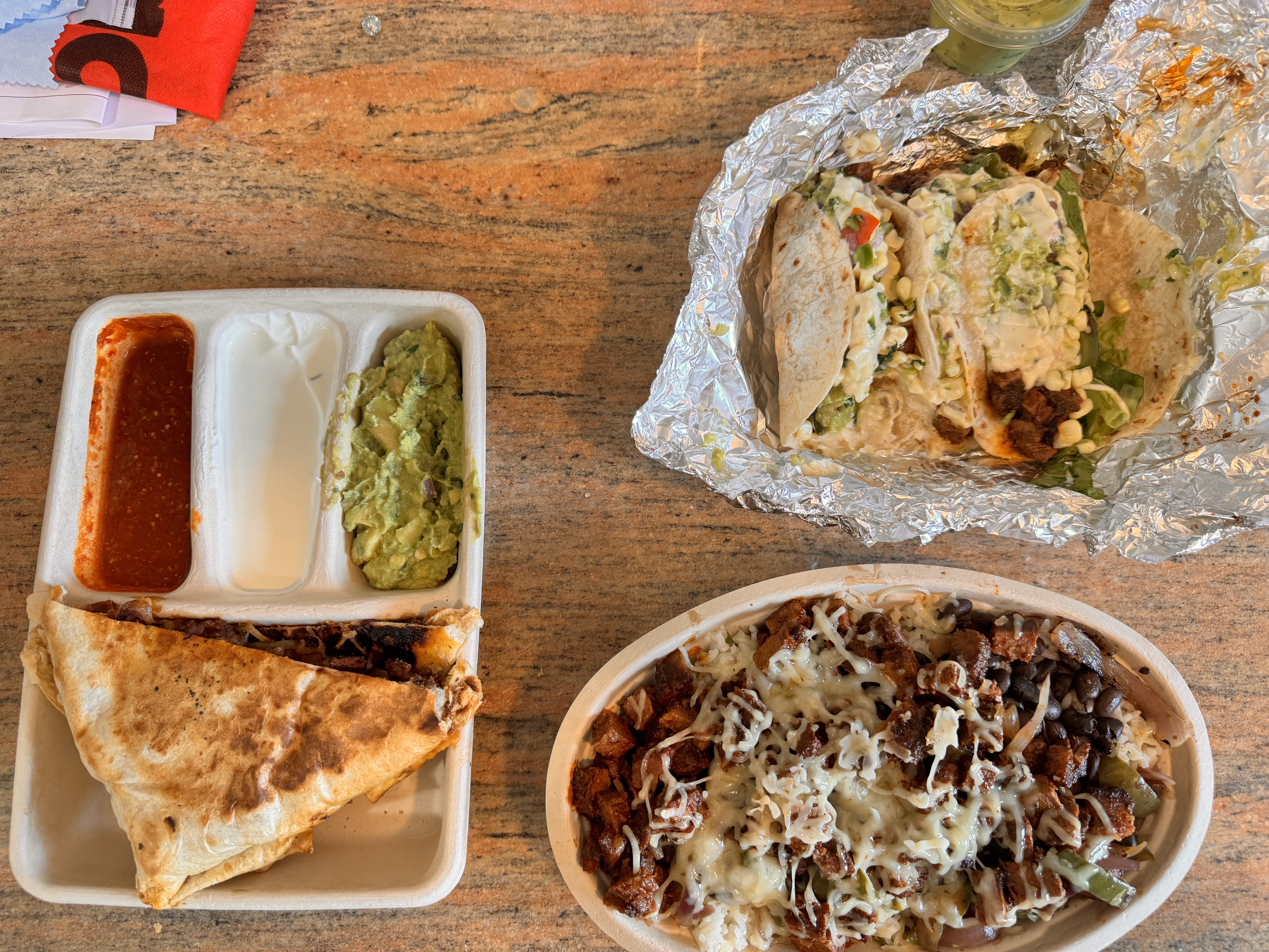 Photo of Chipotle\'s Tacos, Burrito Bowl, and Fajita Quesadilla.