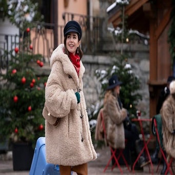 Emily In Paris with a teddy coat and matching purse