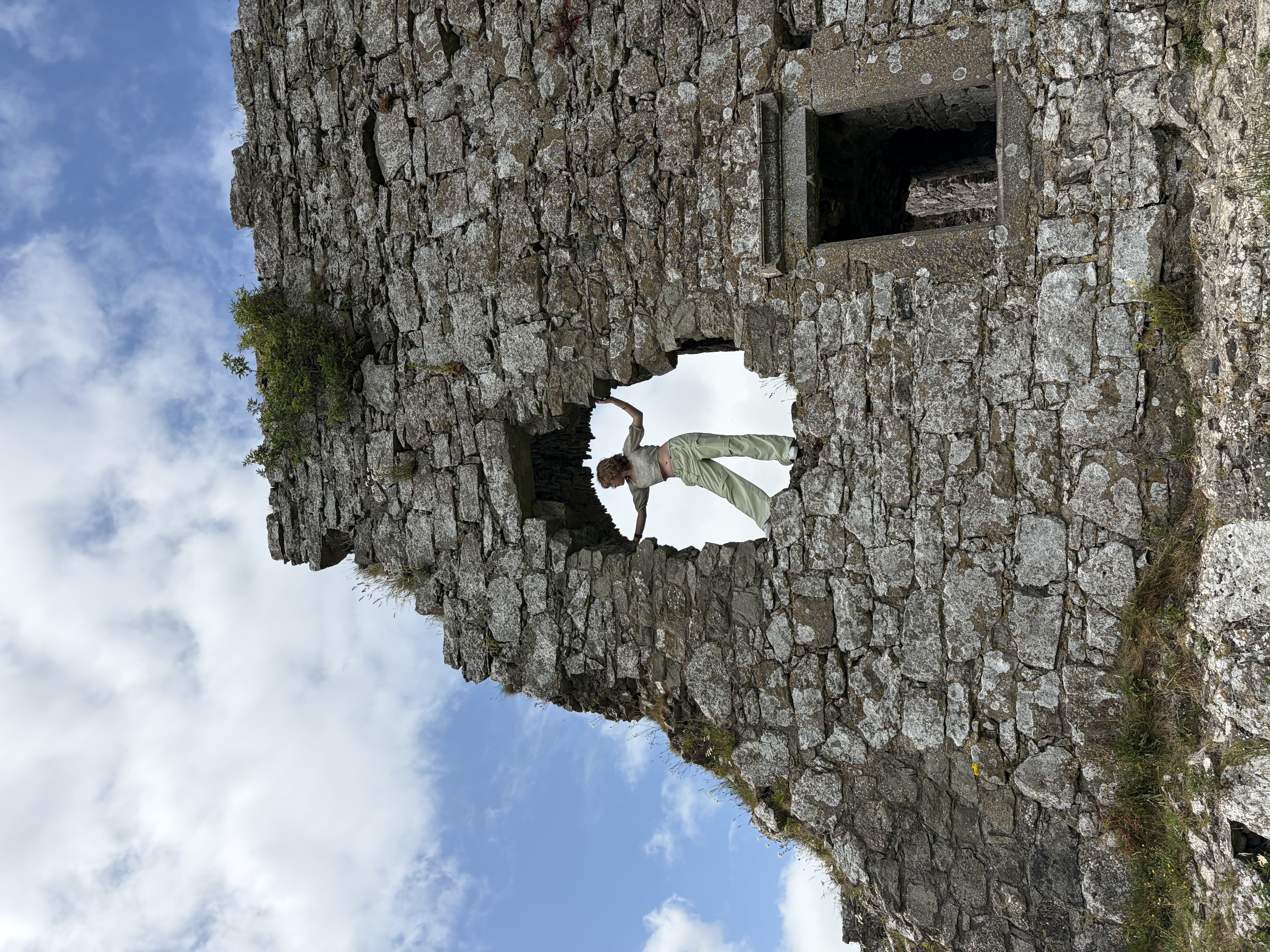 Girl standing on top of castle
