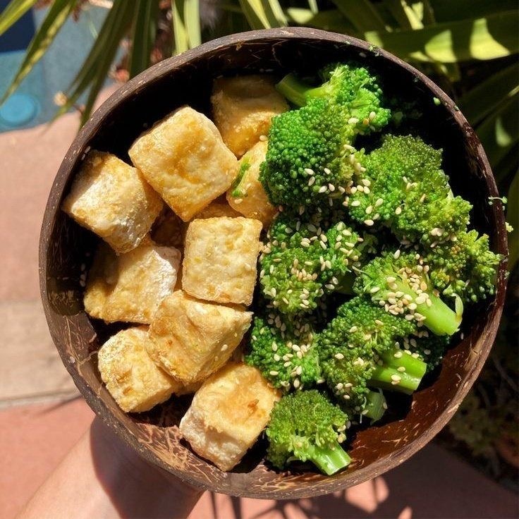 A bowl of tofu and broccoli