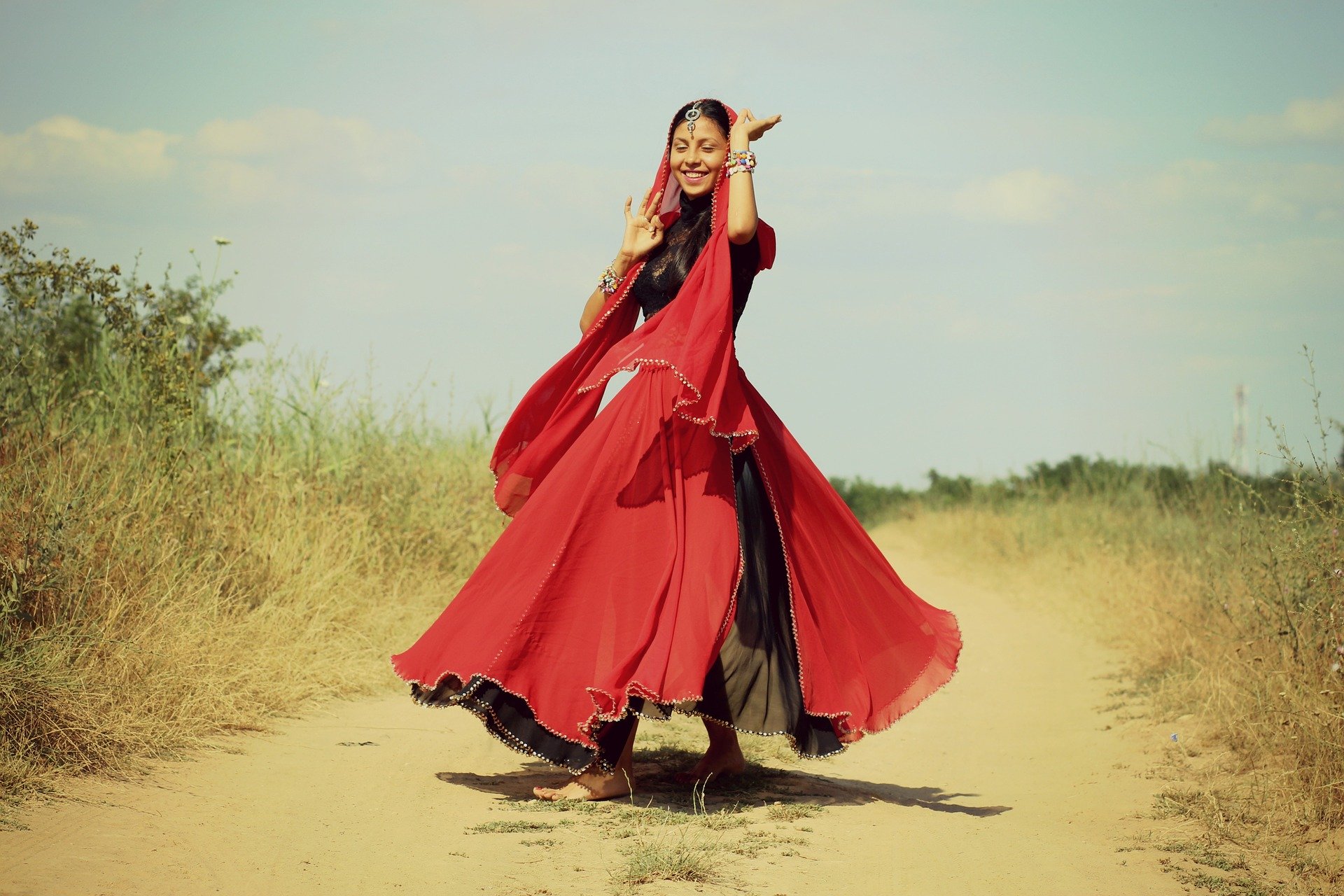 Indian girl dancing in traditional outfit