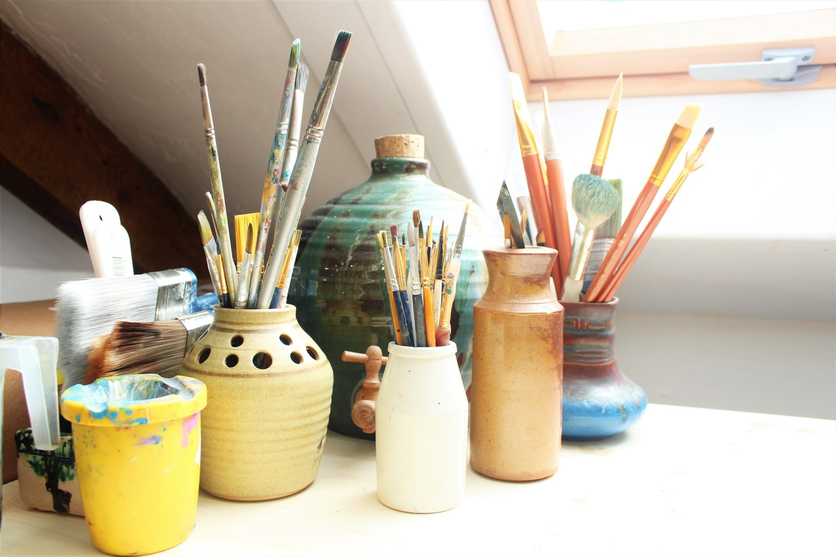 paintbrushes in pots on a table by Sema Martin on Unsplash?width=698&height=466&fit=crop&auto=webp&dpr=4