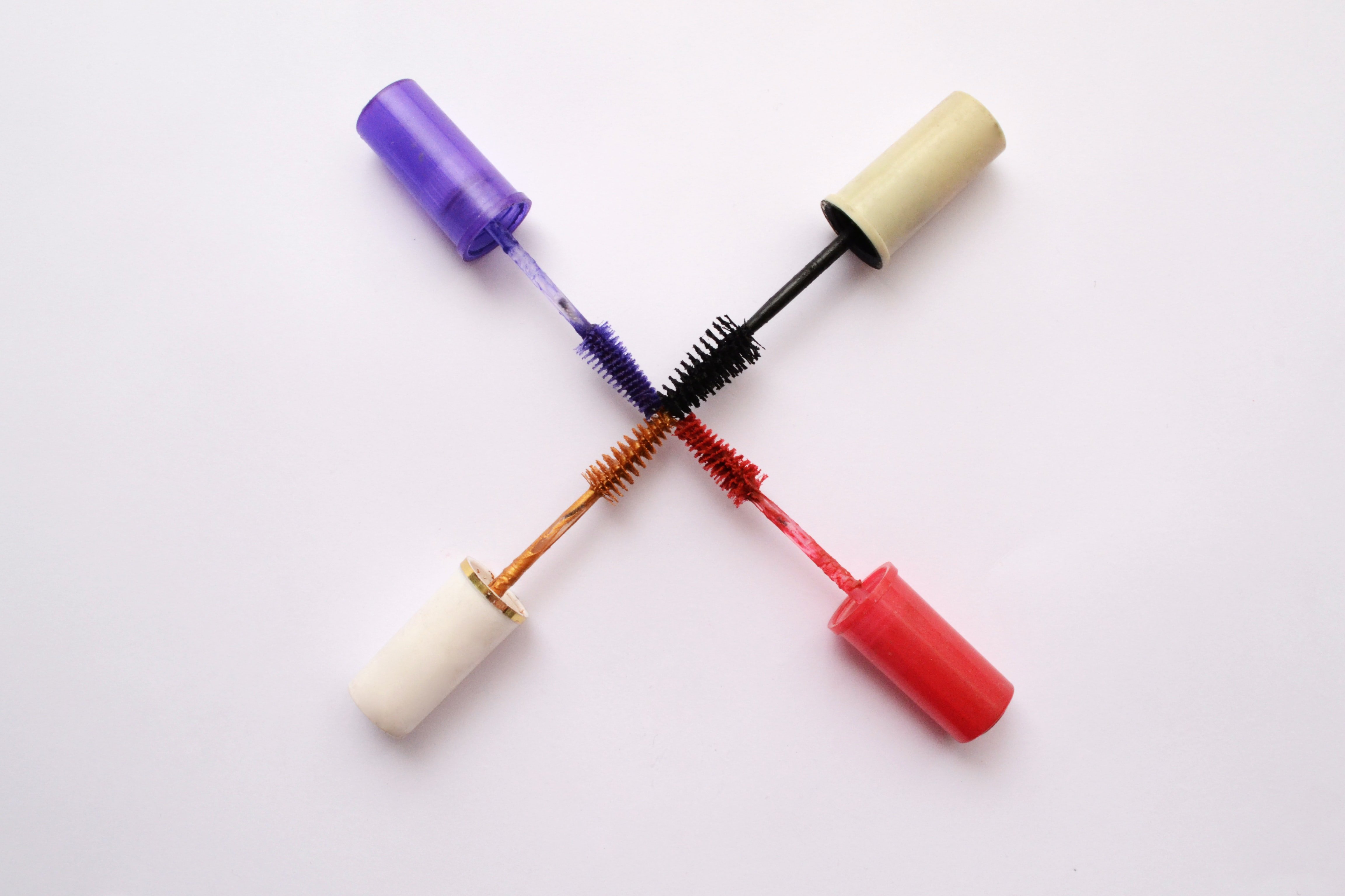 colorful mascara wands by Unsplash