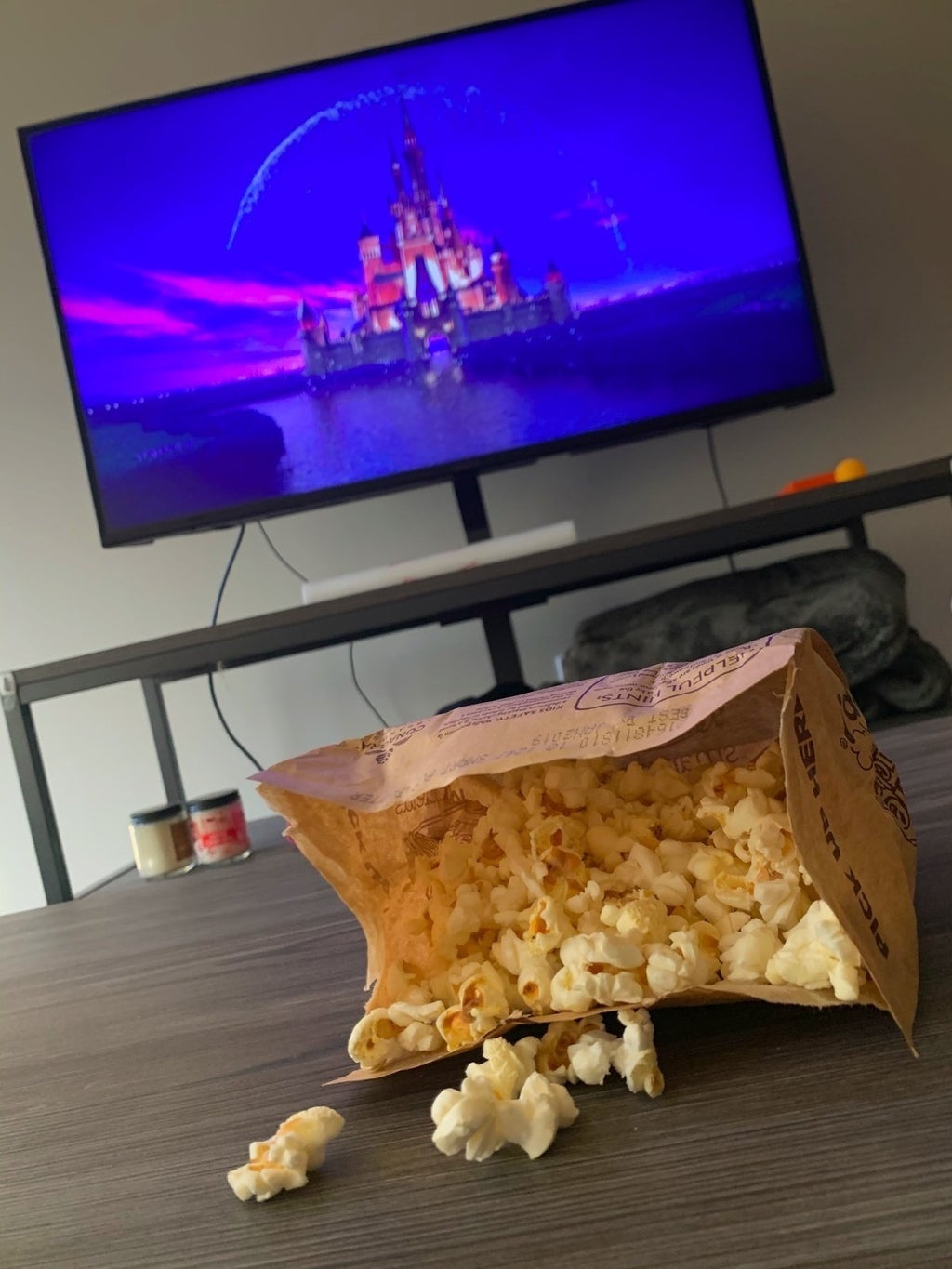 Popcorn and movie playing in the background