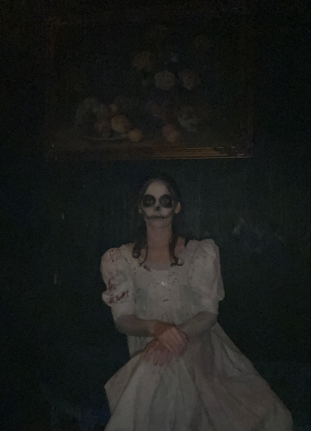 A scare actor with skeleton makeup