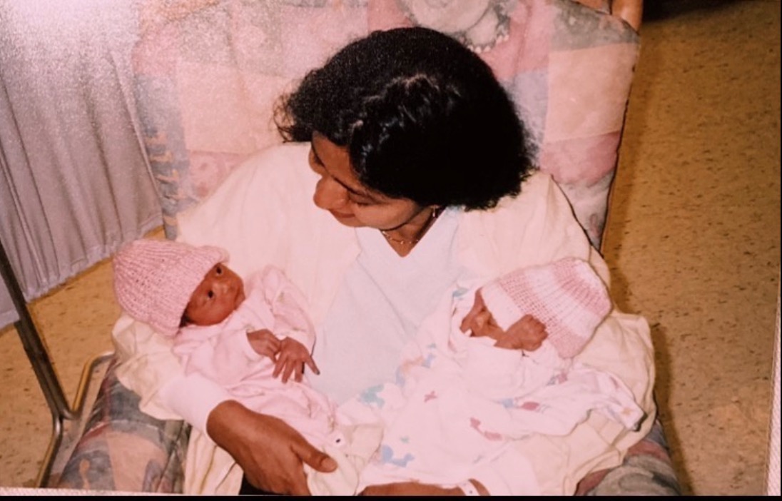 My mom with me and my twin as babies